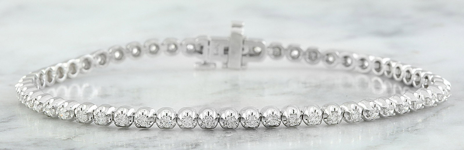 1.45 CTW Diamond 18K White Gold Bracelet: 1.45 CTW Diamond 18K White Gold Bracelet Manufacturer's Suggested Retail Price: $ 7400.00 Stamped: 18K Total Bracelet Weight: 9.5 Grams Bracelet Length: 7 Inches Diamond Weight: 1.45 Carat (F-G Color,
