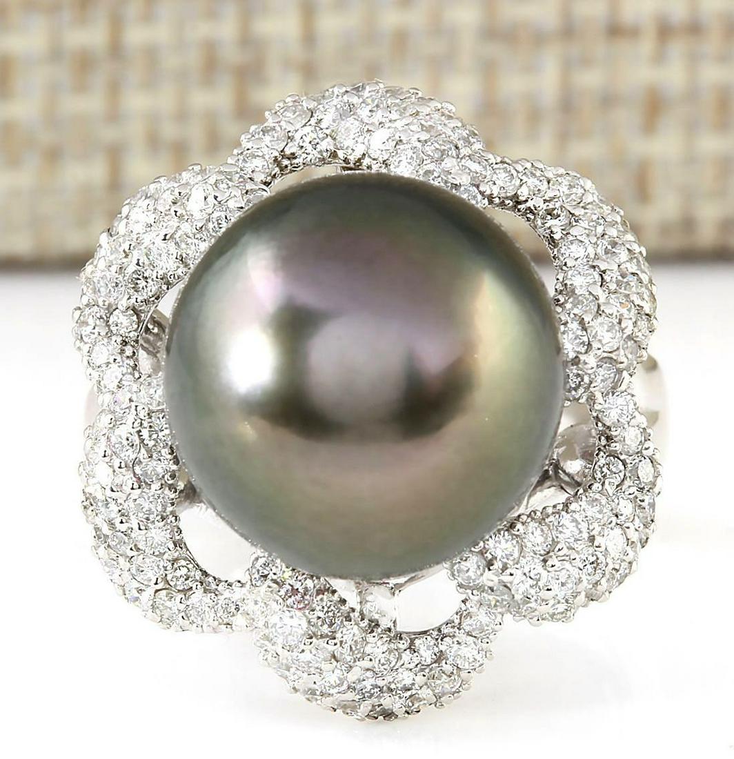 1.30 CTW Natural 14.22mm Black Pearl Diamond Ring 14k: 1.30 CTW Natural 14.22mm Black Pearl Diamond Ring 14k White Gold Manufacturer's Suggested Retail Price: $ 7100.00 Stamped: 14K Ring Size: 7 Total Ring Weight: 9 Grams Diamond Weight: Total Natural dia