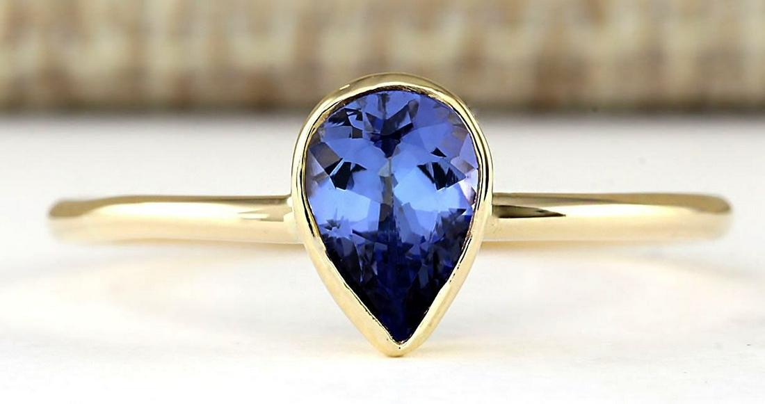 0.50 CTW Natural Tanzanite Ring In 14k Yellow Gold: .50 CTW Natural Tanzanite Ring In 14k Yellow Gold Manufacturer's Suggested Retail Price: $ 900.00 Stamped: 14K Ring Size: 5.75 Total Ring Weight: 1.2 Grams Gemstone Weight: Total Natural Tanzanite Wei