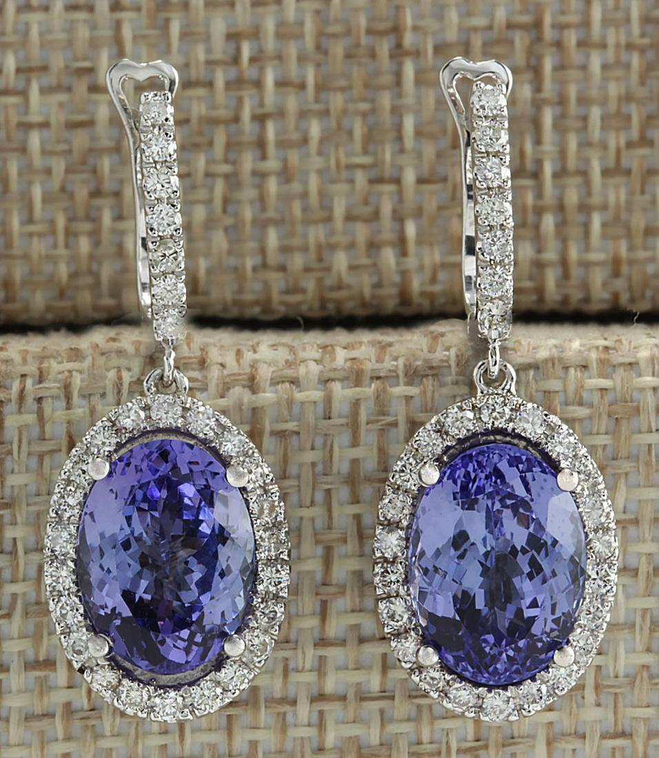 12.15 CTW Natural Tanzanite And Diamond Earrings 14K: 12.15 CTW Natural Tanzanite And Diamond Earrings 14K Solid White Gold Manufacturer's Suggested Retail Price: $ 15250.00 Stamped: 14K Total Earring Weight: 9.5Grams Lenght: 1.40 inches Diamond Weight: 
