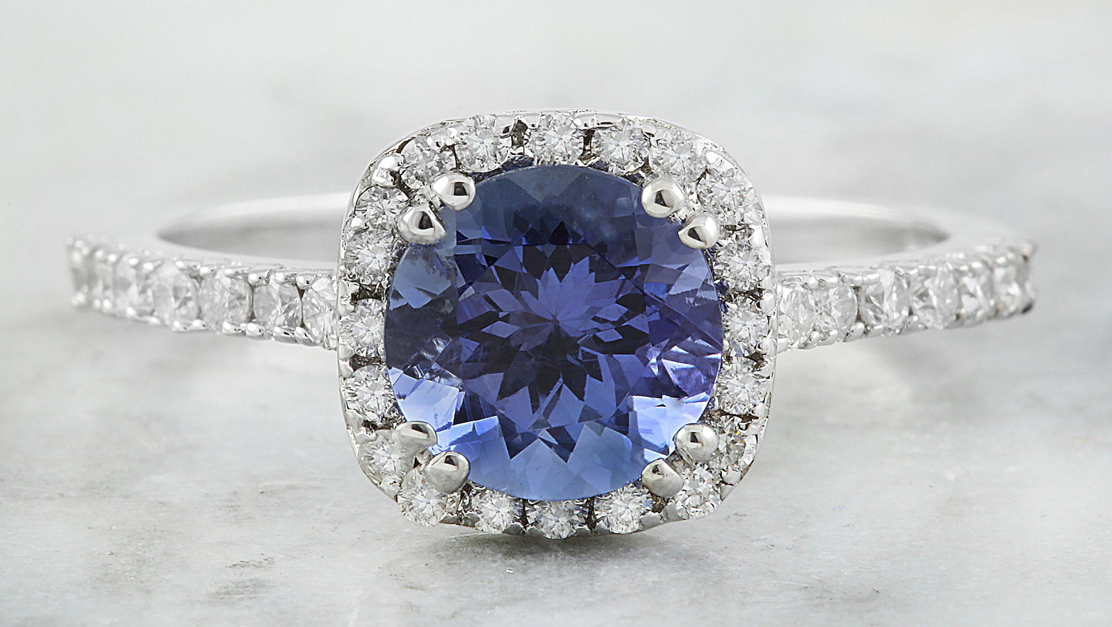 2.01 CTW Tanzanite 14K White Gold Diamond Ring: 2.01 CTW Tanzanite 14K White Gold Diamond Ring Manufacturer's Suggested Retail Price: $ 3400.00 Stamped: 14K Total Ring Weight: 2.6 Grams Tanzanite Weight 1.66 Carat (7.00x7.00 Millimeters) Diamond We
