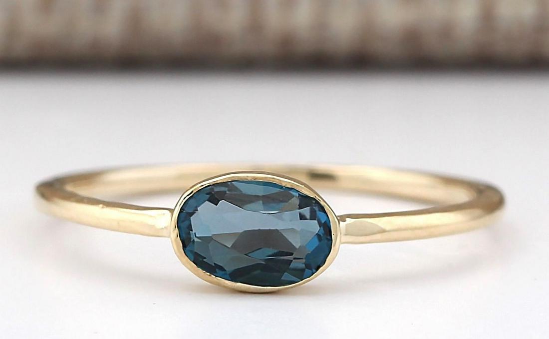 0.60 CTW Natural London Blue Topaz Ring In 14k Yellow: 0.60 CTW Natural London Blue Topaz Ring In 14k Yellow Gold Manufacturer's Suggested Retail Price: $ 600.00 Stamped: 14K Ring Size: 6.25 Total Ring Weight: 1 Grams Gemstone Weight: Total Natural Topaz