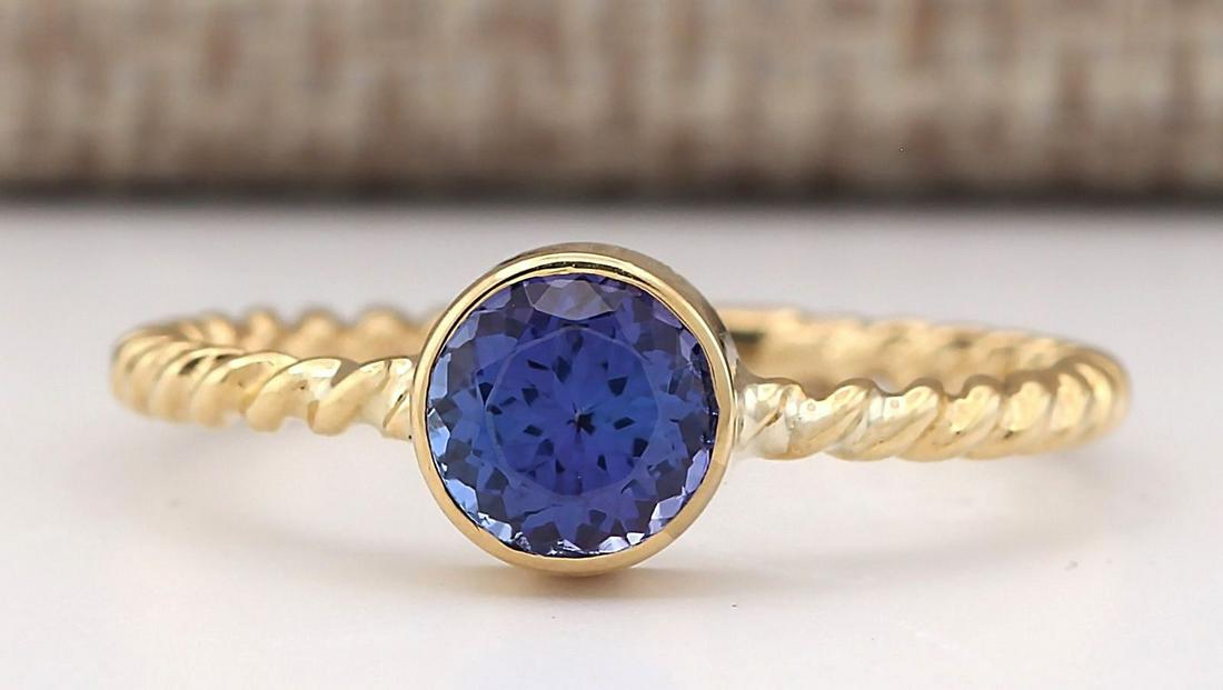 1.00 CTW Natural Blue Tanzanite Ring 14k Solid Yellow: 1.00 CTW Natural Blue Tanzanite Ring 14k Solid Yellow Gold Manufacturer's Suggested Retail Price: $ 1700.00 Stamped: 14K Ring Size: 7.5 Total Ring Weight: 3 Grams Gemstone Weight: Total Natural Blue T