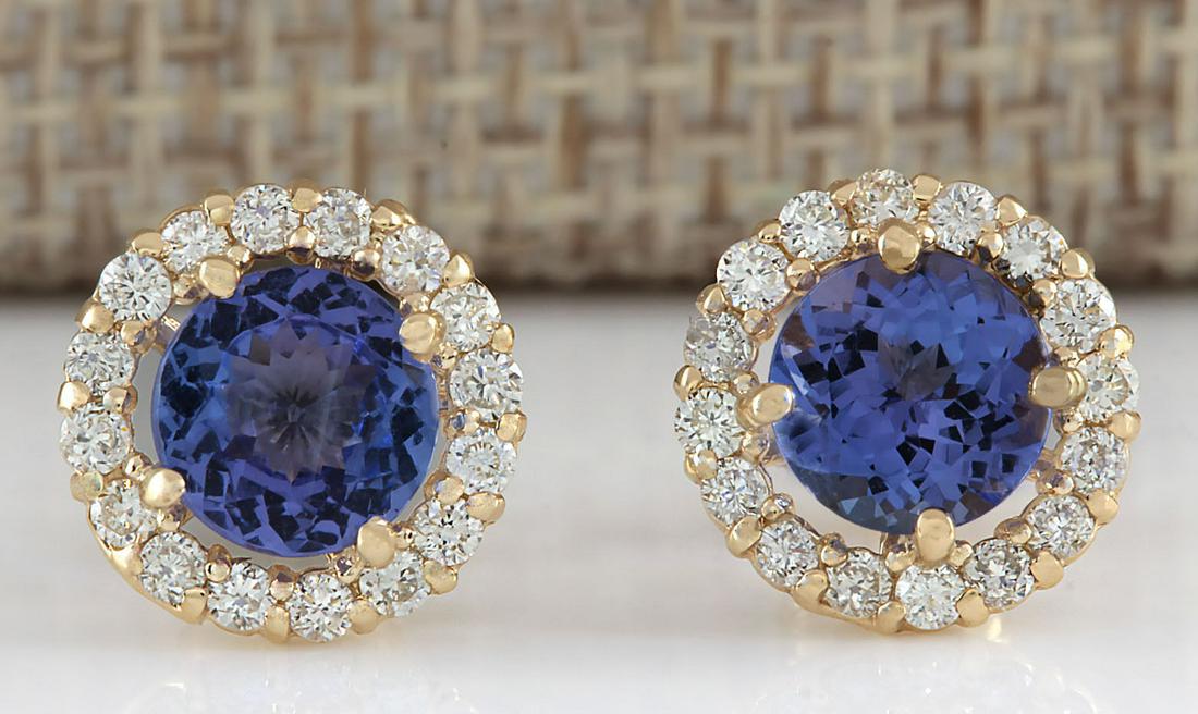 3.65 CTW Natural Blue Tanzanite And Diamond Earrings: 3.65 CTW Natural Blue Tanzanite And Diamond Earrings 14k Solid Yellow Gold Manufacturer's Suggested Retail Price: $ 3400.00 Stamped: 14K Total Earring Weight: 2.00Grams Diamond Weight: Total Natural d