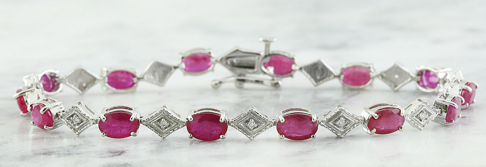 8.50 CTW Ruby 18K White Gold Diamond Bracelet: 8.50 CTW Ruby 18K White Gold Diamond Bracelet Manufacturer's Suggested Retail Price: $ 4150.00 Stamped: 18K Total Bracelet Weight: 7.7 Grams Bracelet Length: 7 Inches Ruby Weight: 8.30 Carat (6.00x4.0