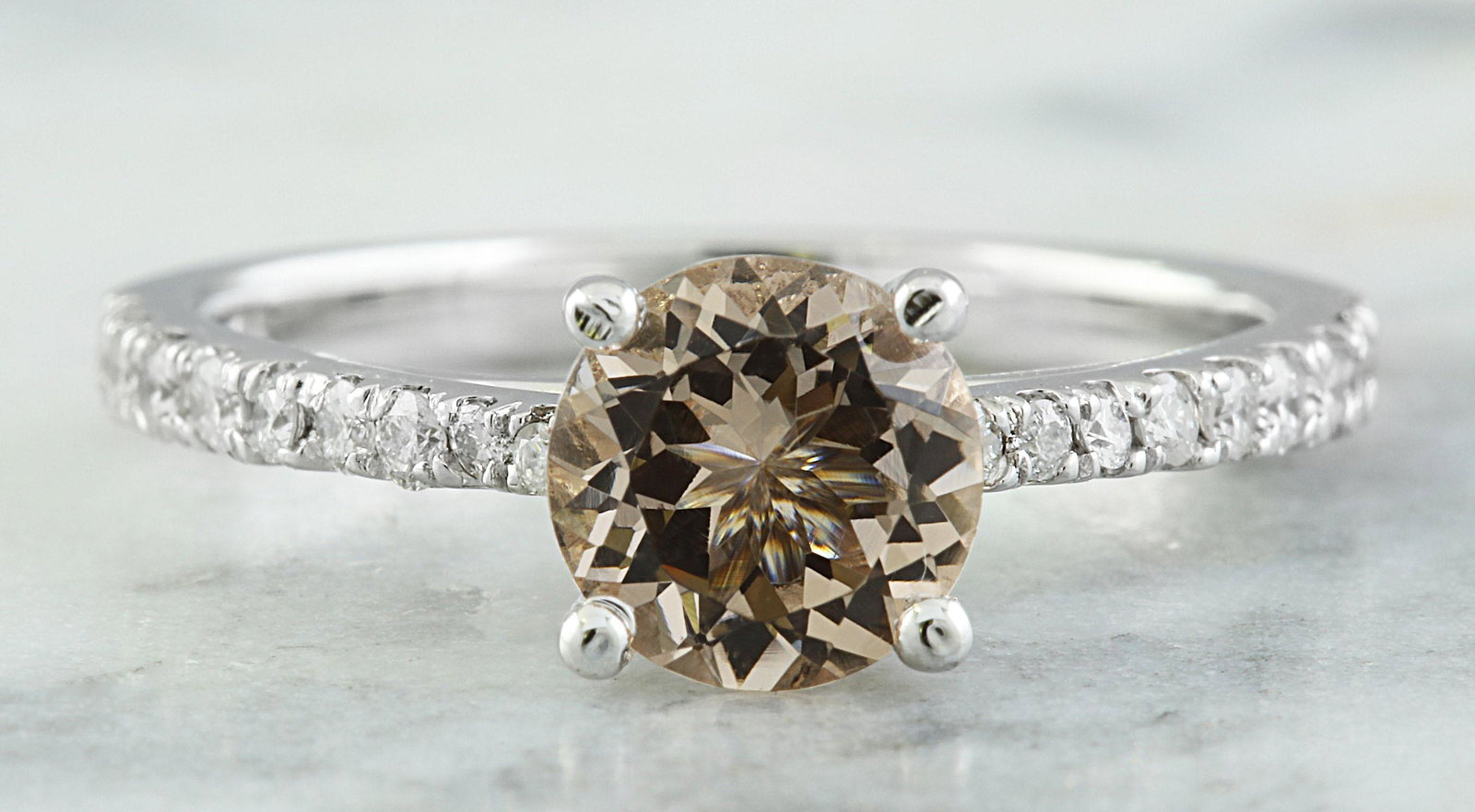 1.30 CTW Morganite 14K White Gold Diamond Ring: 1.30 CTW Morganite 14K White Gold Diamond Ring Manufacturer's Suggested Retail Price: $ 2300.00 Stamped: 14K Ring Size: 7 Total Ring Weight: 2.9 Grams Morganite Weight: 1.01 Carat (6.80x6.80 Millimete