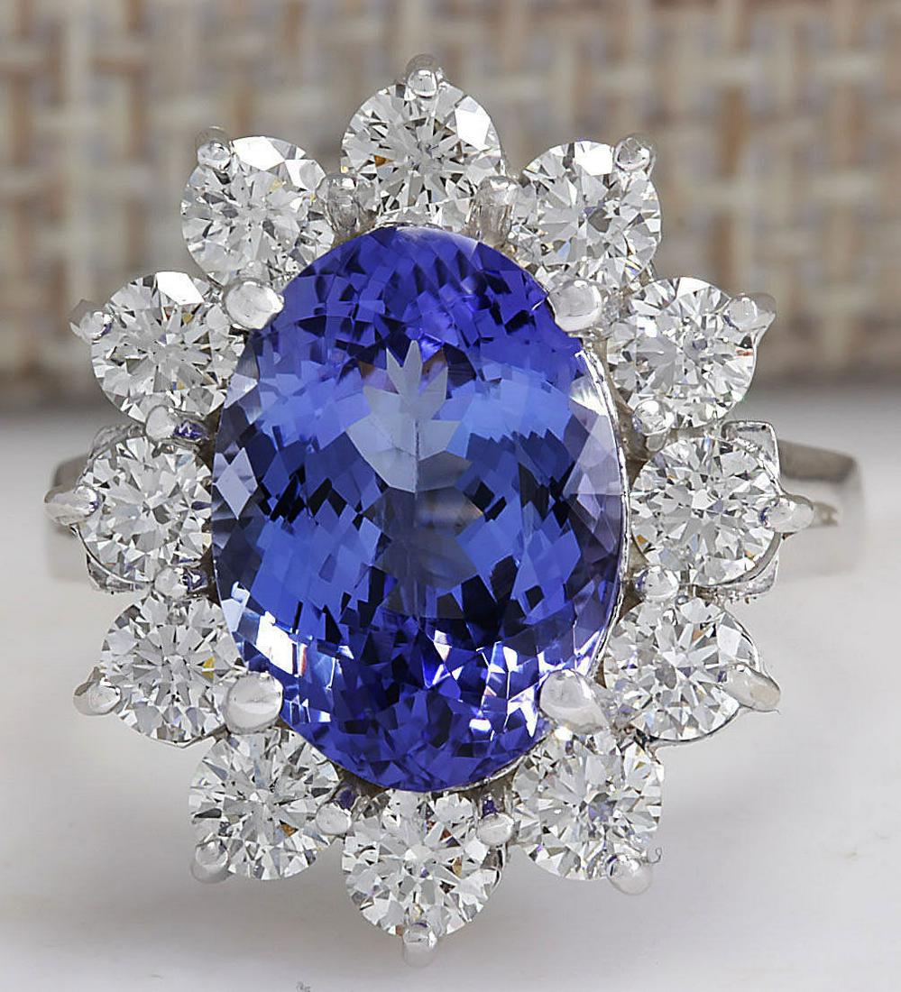 5.98 CTW Natural Blue Tanzanite And Diamond Ring 18K: 5.98 CTW Natural Blue Tanzanite And Diamond Ring 18K Solid White Gold Manufacturer's Suggested Retail Price: $ 11250.00 Stamped: 18K Ring Size: 6 Total Ring Weight: 4.7 Grams Diamond Weight: Total Nat