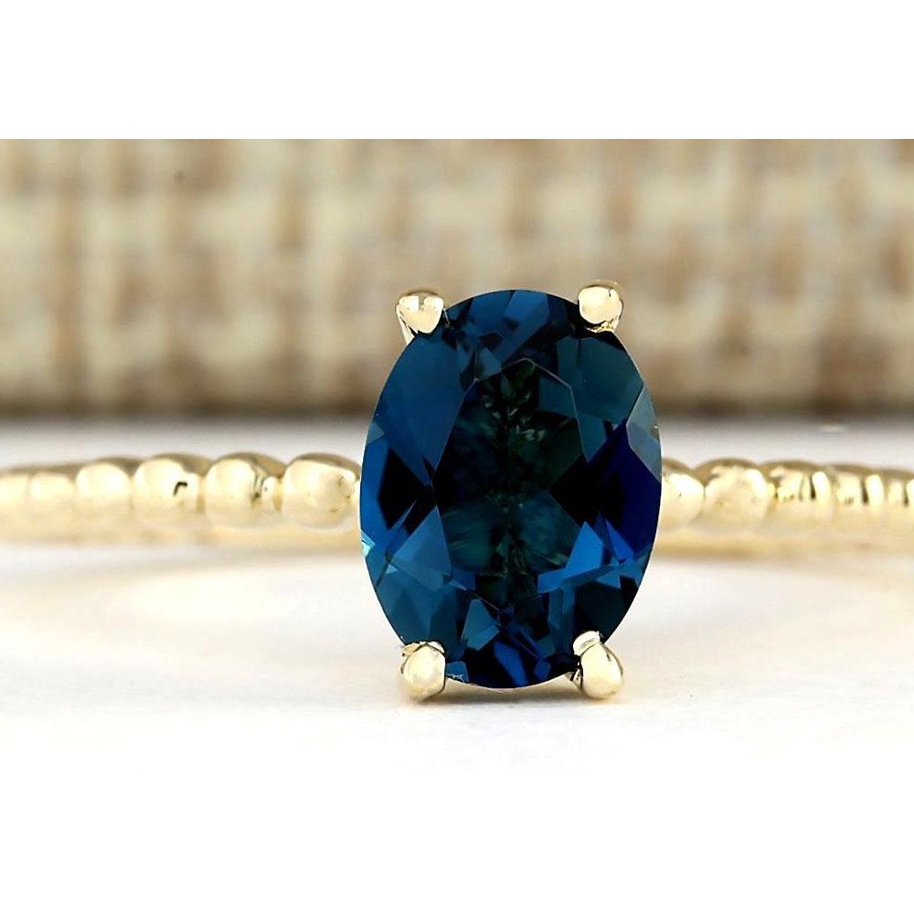 1.39 CTW Natural London Blue Topaz Ring In 14k Yellow: 1.39 CTW Natural London Blue Topaz Ring In 14k Yellow Gold Manufacturer's Suggested Retail Price: $ 1350.00 Stamped: 14K Ring Size: 6.5 Total Ring Weight: 8.8 Grams Gemstone Weight: Total Natural Topa