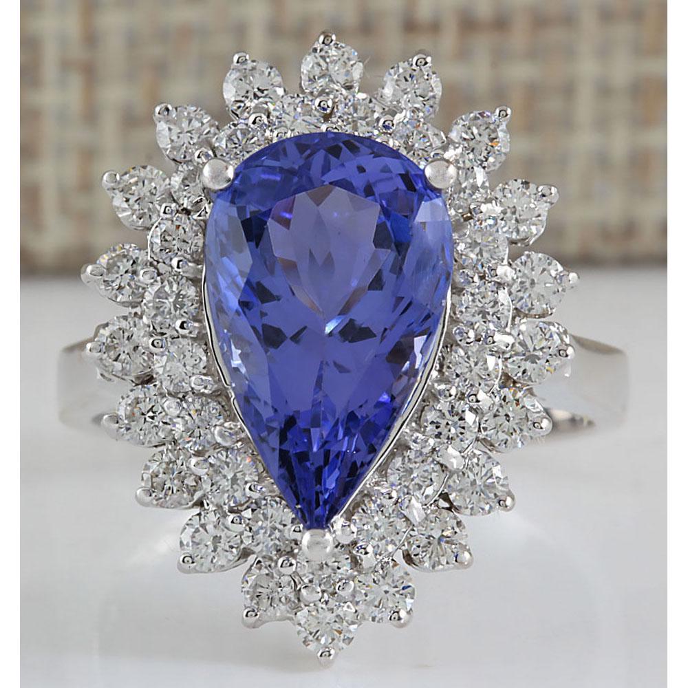 5.73 CTW Natural Blue Tanzanite And Diamond Ring In 18K: 5.73 CTW Natural Blue Tanzanite And Diamond Ring In 18K White Gold Manufacturer's Suggested Retail Price: $ 9400.00 Stamped: 18K Ring Size: 7 Total Ring Weight: 6.5 Grams Diamond Weight: Total Natural