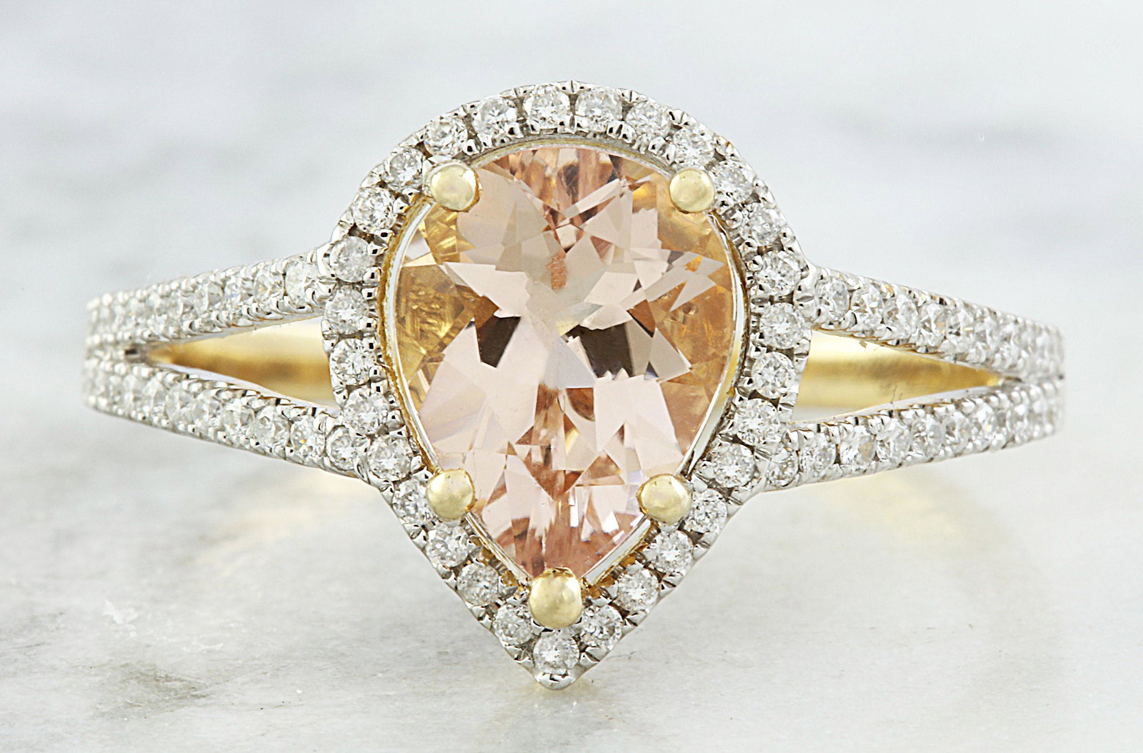 2.32 CTW Morganite 14K Yellow Gold Diamond Ring: 2.32 CTW Morganite 14K Yellow Gold Diamond Ring Manufacturer's Suggested Retail Price: $ 2200.00 Stamped: 14K Total Ring Weight: 2.6 Grams Morganite Weight 2.05 Carat (9.00x7.00 Millimeters) Diamond W