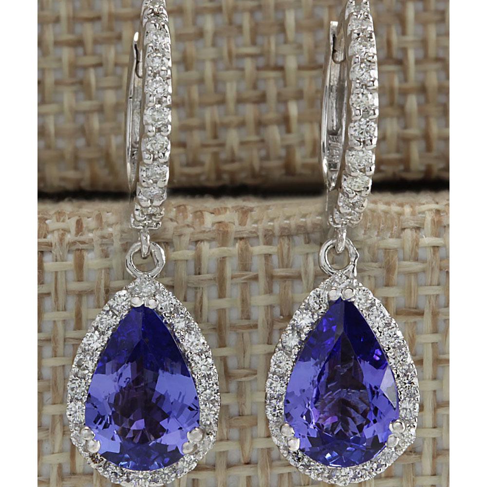 3.97 CTW Natural Tanzanite And Diamond Earrings 18K: 3.97 CTW Natural Tanzanite And Diamond Earrings 18K Solid White Gold Manufacturer's Suggested Retail Price: $ 5900.00 Stamped: 18K Total Earring Weight: 5.3Grams Lenght: 1.15 inches Diamond Weight: To