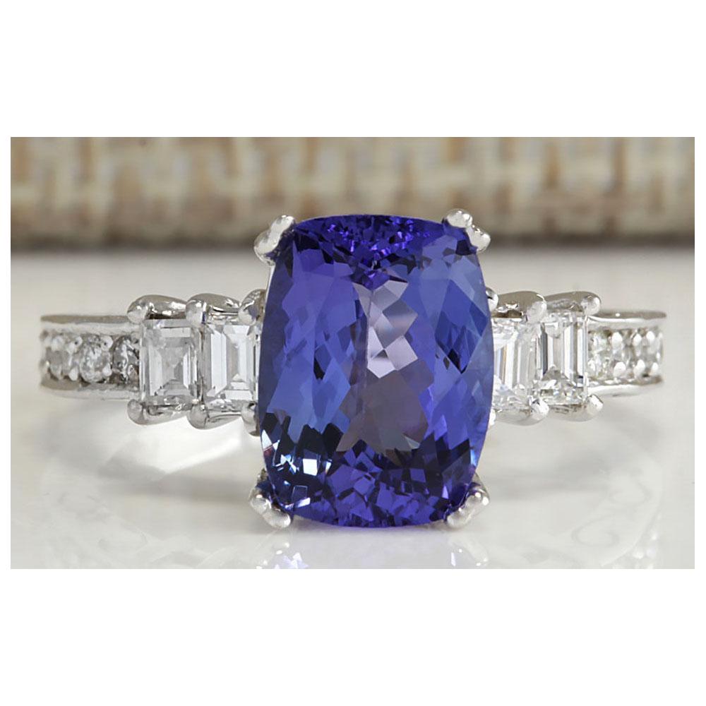 3.75 CTW Natural Blue Tanzanite And Diamond Ring In 18K: 3.75 CTW Natural Blue Tanzanite And Diamond Ring In 18K White Gold Manufacturer's Suggested Retail Price: $ 7150.00 Stamped: 18K Ring Size: 6.25 Total Ring Weight: 4.5 Grams Diamond Weight: Total Natu