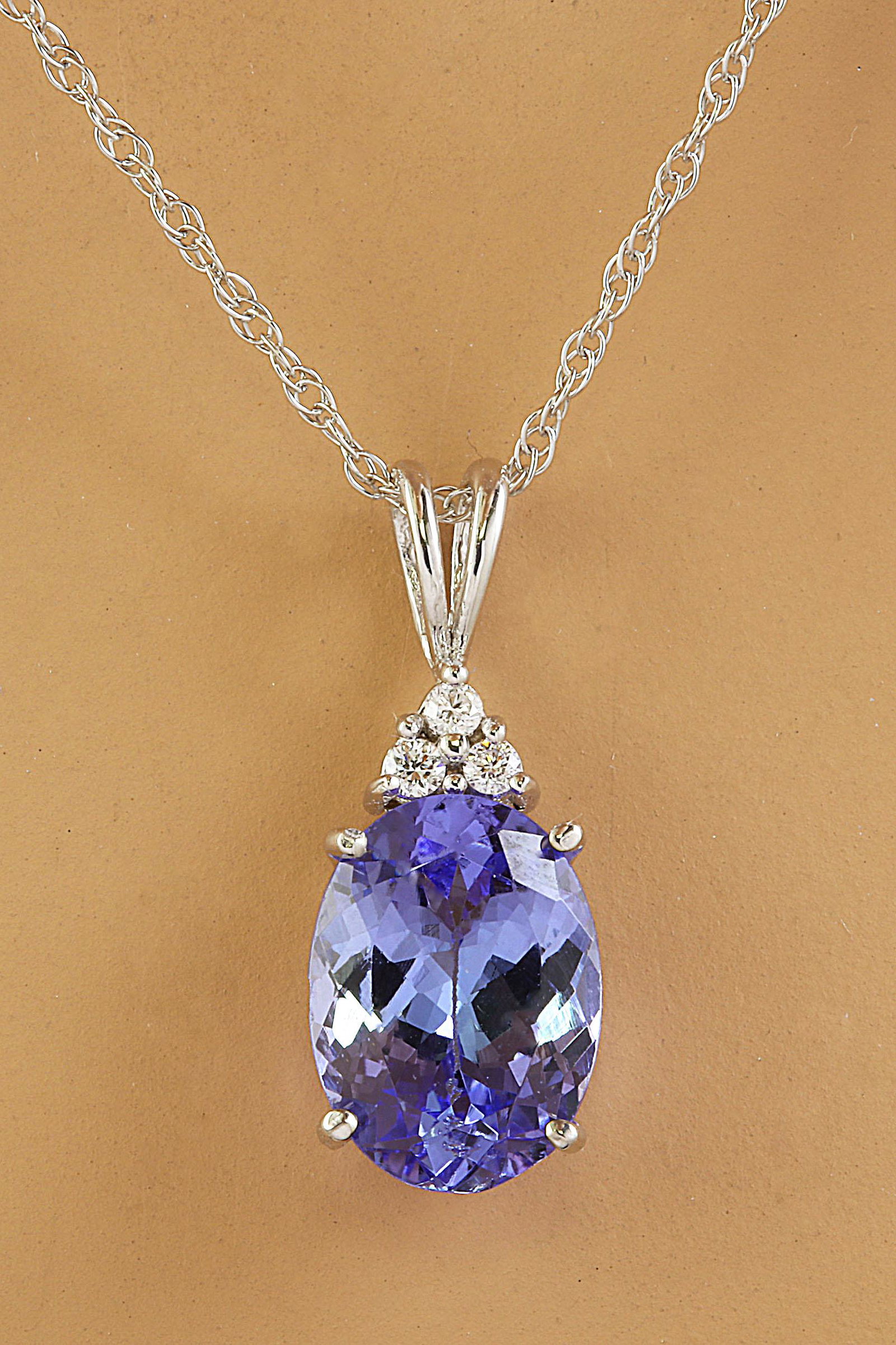 3.20 CTW Tanzanite 18K White Gold Diamond Necklace: 3.20 CTW Tanzanite 18K White Gold Diamond Necklace Manufacturer's Suggested Retail Price: $ 2850.00 Stamped: 18K Total Necklace Weight: 1.5 Grams Necklace Length: 18 Inches Tanzanite Weight: 3.15 Cara