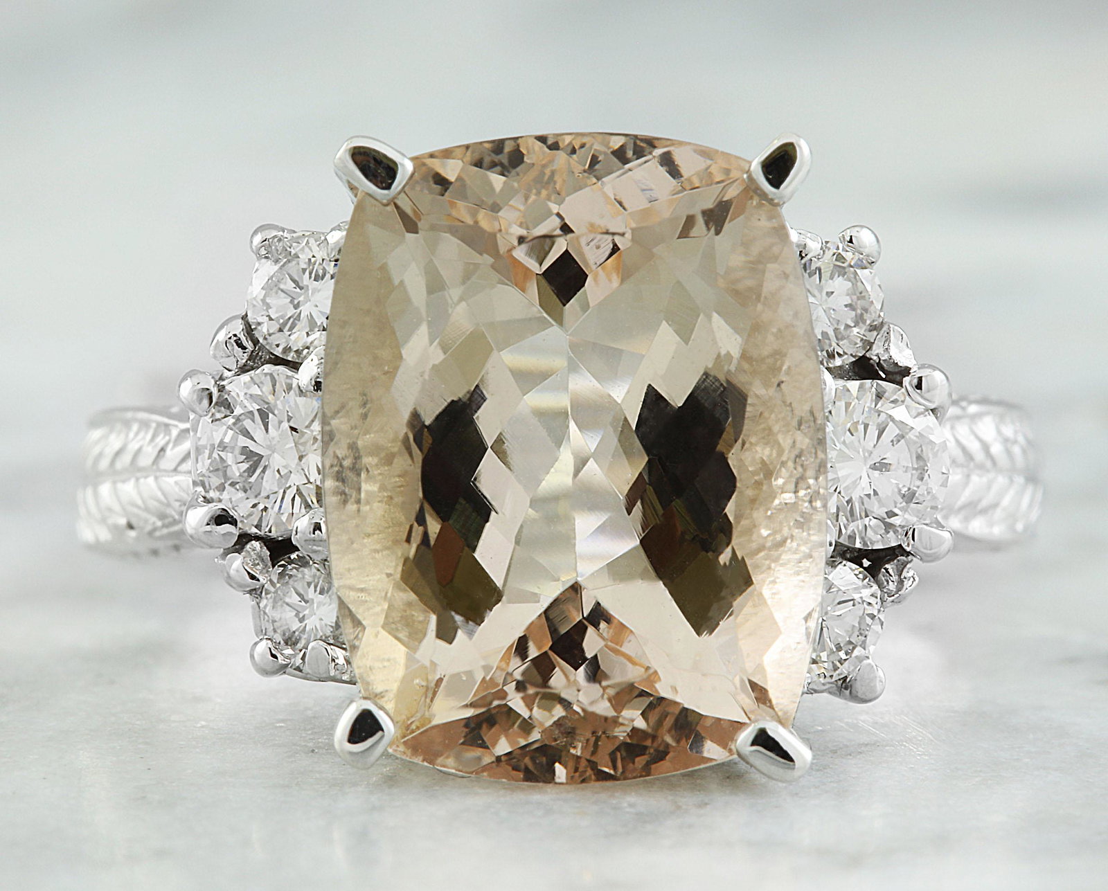 6.69 CTW Morganite 18K White Gold Diamond Ring: 6.69 CTW Morganite 18K White Gold Diamond Ring Manufacturer's Suggested Retail Price: $ 6450.00 Stamped: 18K Total Ring Weight: 7.5 Grams Morganite Weight: 6.09 Carat (13.20x10.30 Millimeters) Diamond