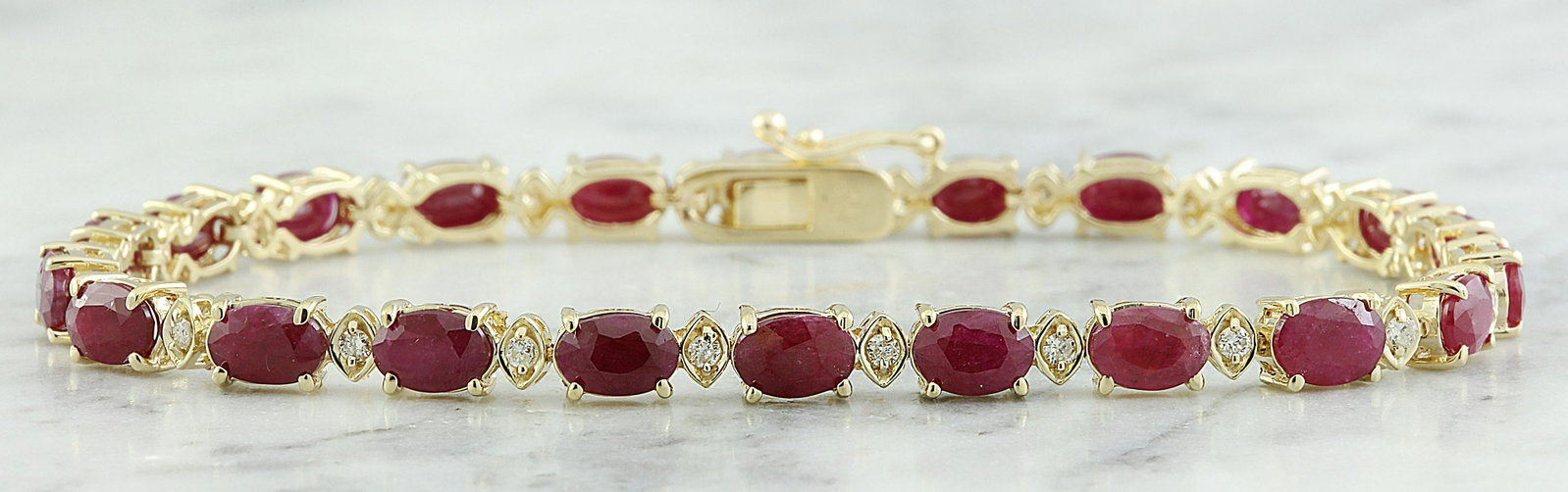 11.95 CTW Ruby 18K Yellow Gold Diamond Bracelet: 11.95 CTW Ruby 18K Yellow Gold Diamond Bracelet Manufacturer's Suggested Retail Price: $ 6200.00 Stamped: 18K Total Bracelet Weight: 11.1 Grams Bracelet Length: 7.5 Inches Ruby Weight: 11.45 Carat (6.