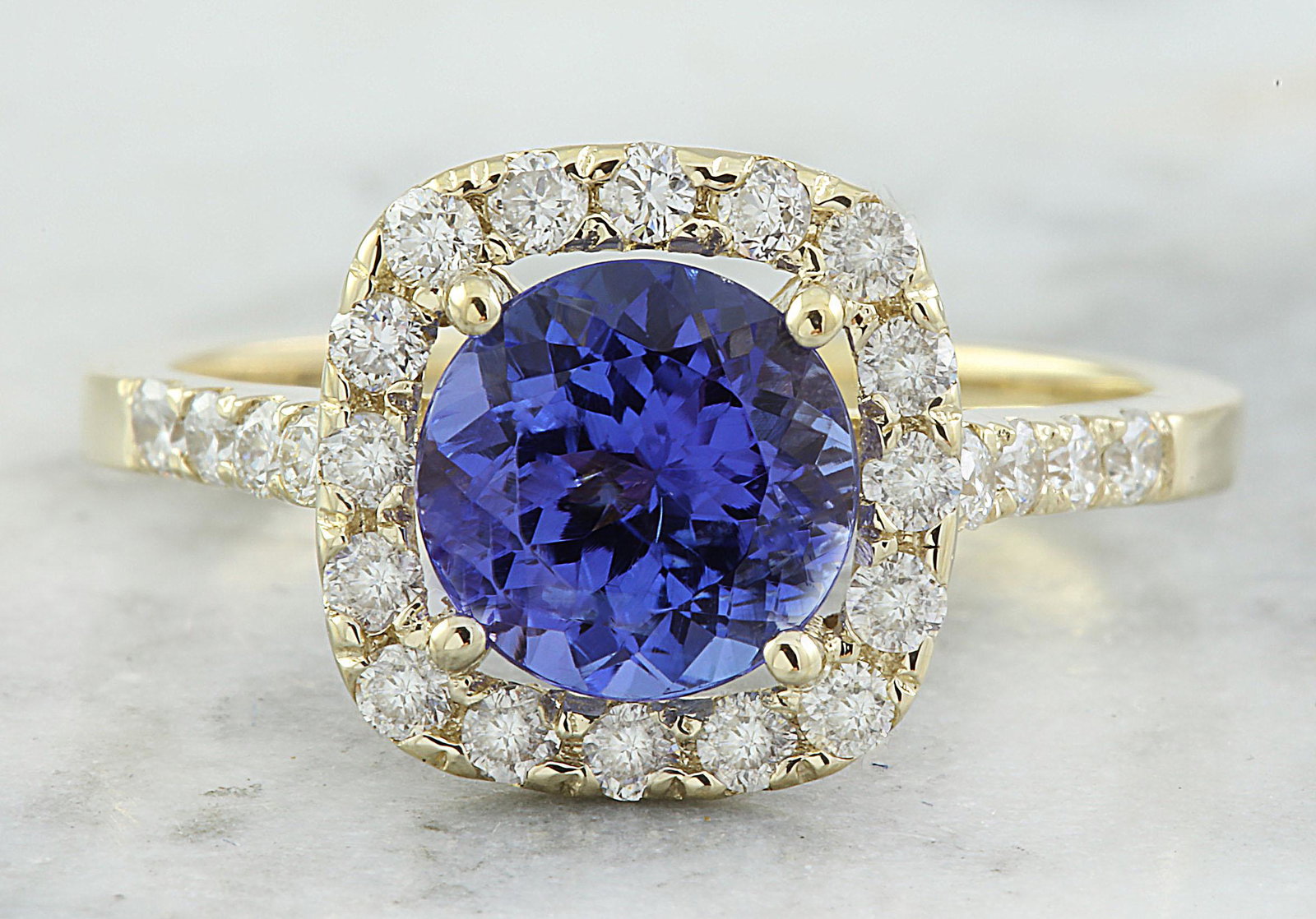 2.28 CTW Tanzanite 18K Yellow Gold Diamond ring: 2.28 CTW Tanzanite 18K Yellow Gold Diamond ring Manufacturer's Suggested Retail Price: $ 4400.00 Stamped: 18K Total Ring Weight: 3.2 Grams Tanzanite Weight 1.78 Carat (7.35x7.35 Millimeters) Diamond W