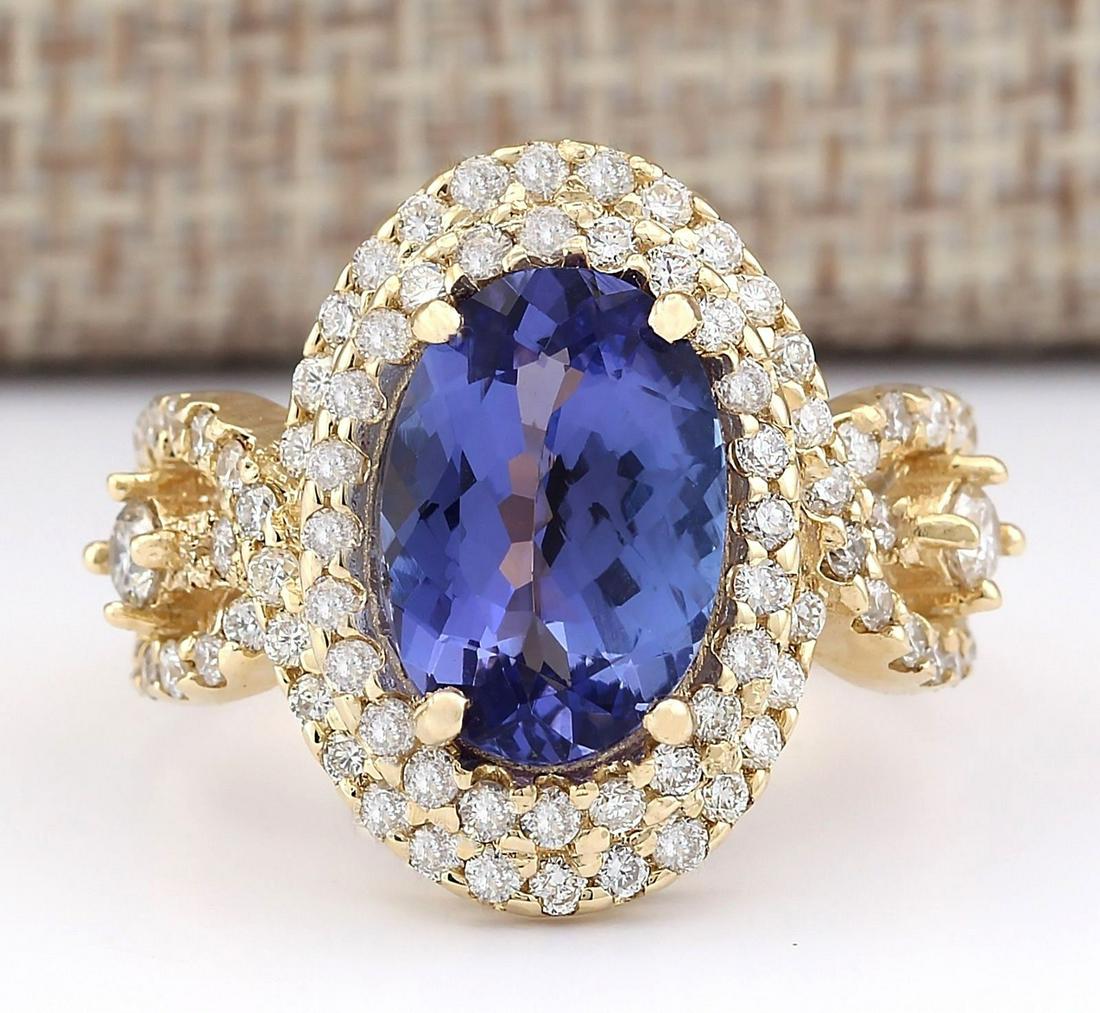 5.11 CTW Natural Tanzanite And Diamond Ring In 18K: 5.11 CTW Natural Tanzanite And Diamond Ring In 18K Yellow Gold Manufacturer's Suggested Retail Price: $ 9250.00 Stamped: 18K Ring Size: 7 Total Ring Weight: 7.5 Grams Diamond Weight: Total Natural dia