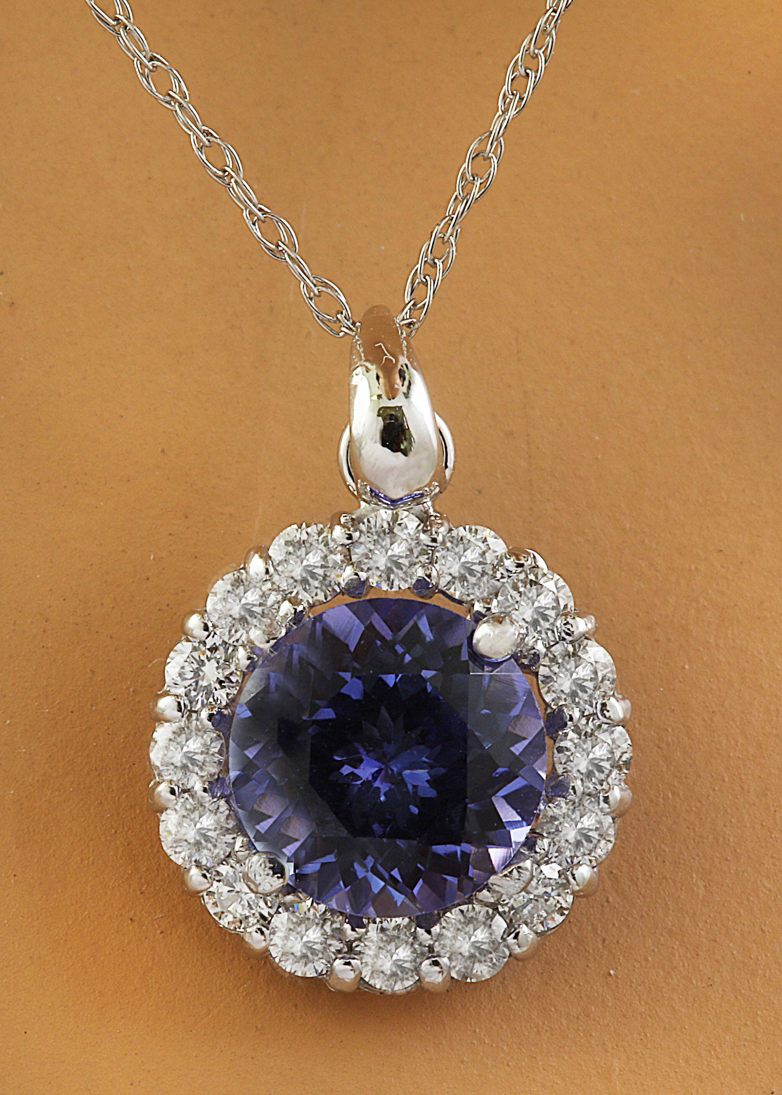 1.82 CTW Tanzanite 18K White Gold Diamond Necklace: 1.82 CTW Tanzanite 18K White Gold Diamond Necklace Manufacturer's Suggested Retail Price: $ 2750.00 Stamped: 18K Total Necklace Weight: 0.90 Grams Necklace Length 18 Inches Tanzanite Weight: 1.50 Cara