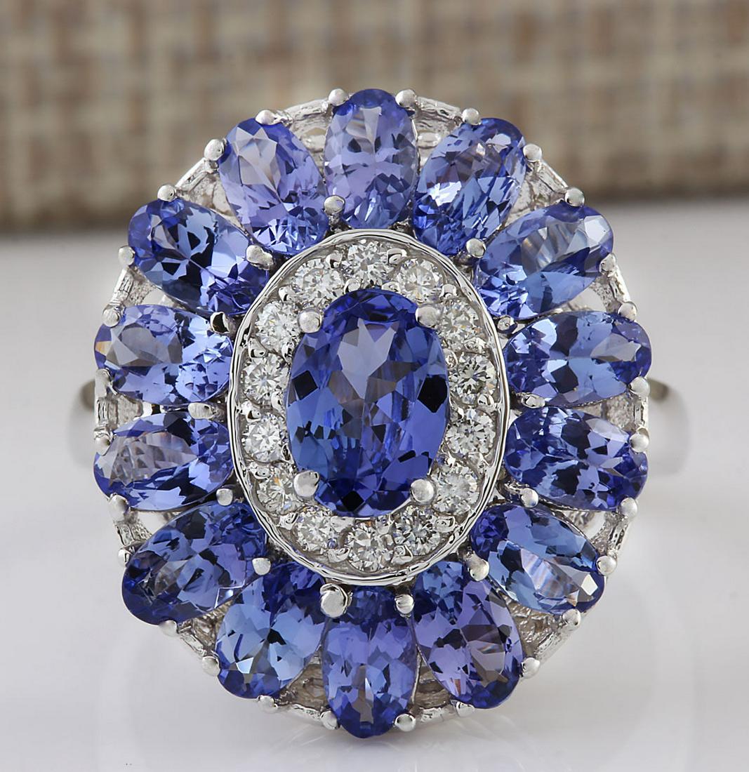 4.77 CTW Natural Tanzanite And Diamond Ring In 14k: 4.77 CTW Natural Tanzanite And Diamond Ring In 14k White Gold Manufacturer's Suggested Retail Price: $ 3000.00 Stamped: 14K Ring Size: 6.75 Total Ring Weight: 5.8 Grams Diamond Weight: Total Natural d