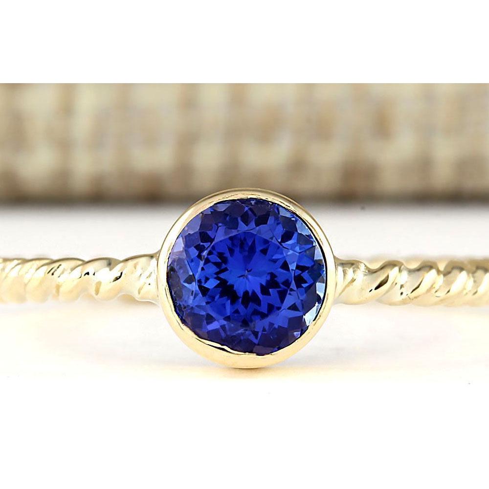 1.00 CTW Natural Tanzanite Ring In 14k Yellow Gold: 1.00 CTW Natural Tanzanite Ring In 14k Yellow Gold Manufacturer's Suggested Retail Price: $ 1500.00 Stamped: 14K Ring Size: 7.5 Total Ring Weight: 2.2 Grams Gemstone Weight: Total Natural Tanzanite We