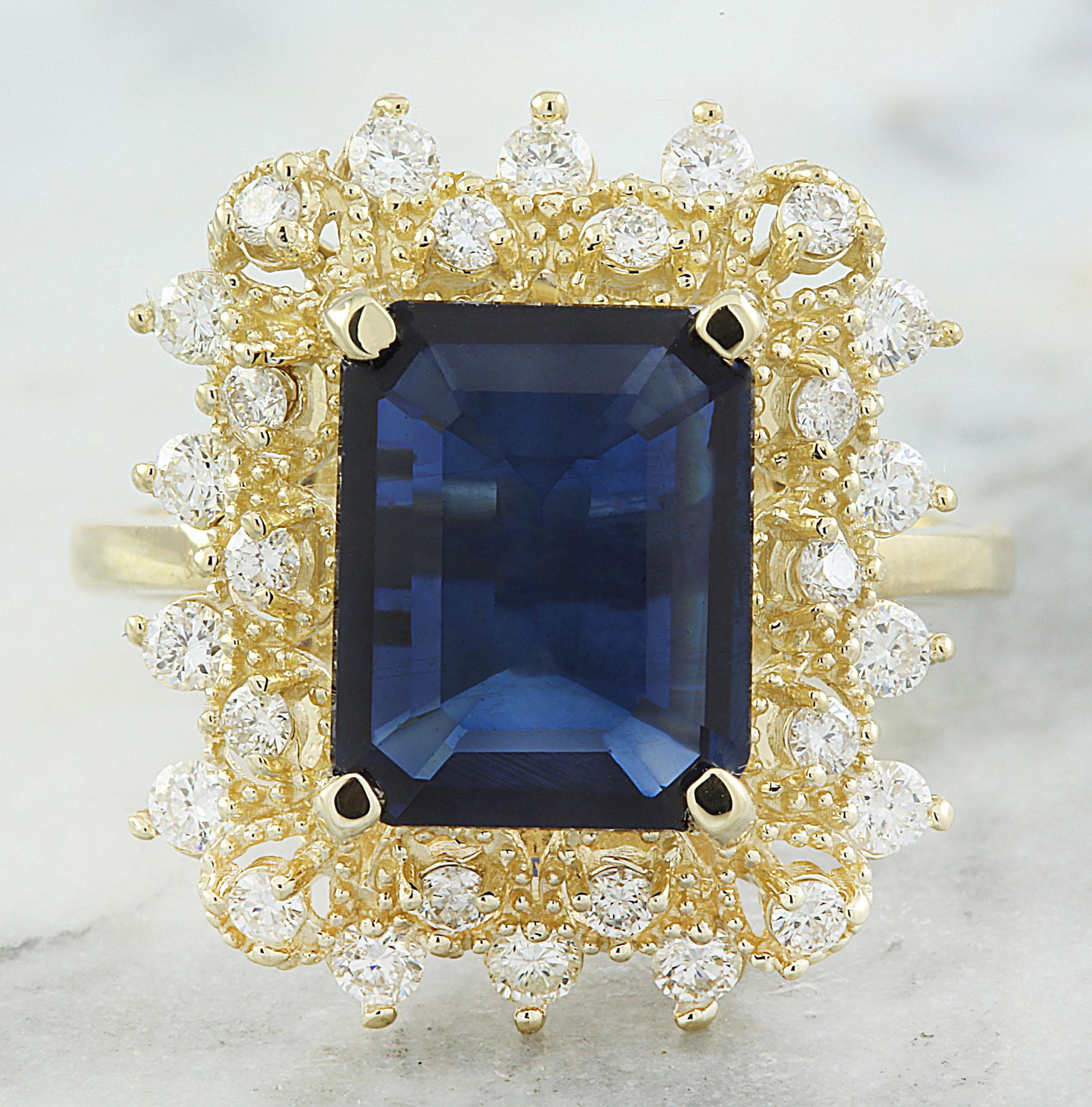 7.03 CTW Sapphire 14K Yellow Gold Diamond Ring: 7.03 CTW Sapphire 14K Yellow Gold Diamond Ring Manufacturer's Suggested Retail Price: $ 3600.00 Stamped: 14K Total Ring Weight: 5.1 Grams Sapphire Weight 3.43 Carat (10.80x8.50 Millimeters) Diamond We