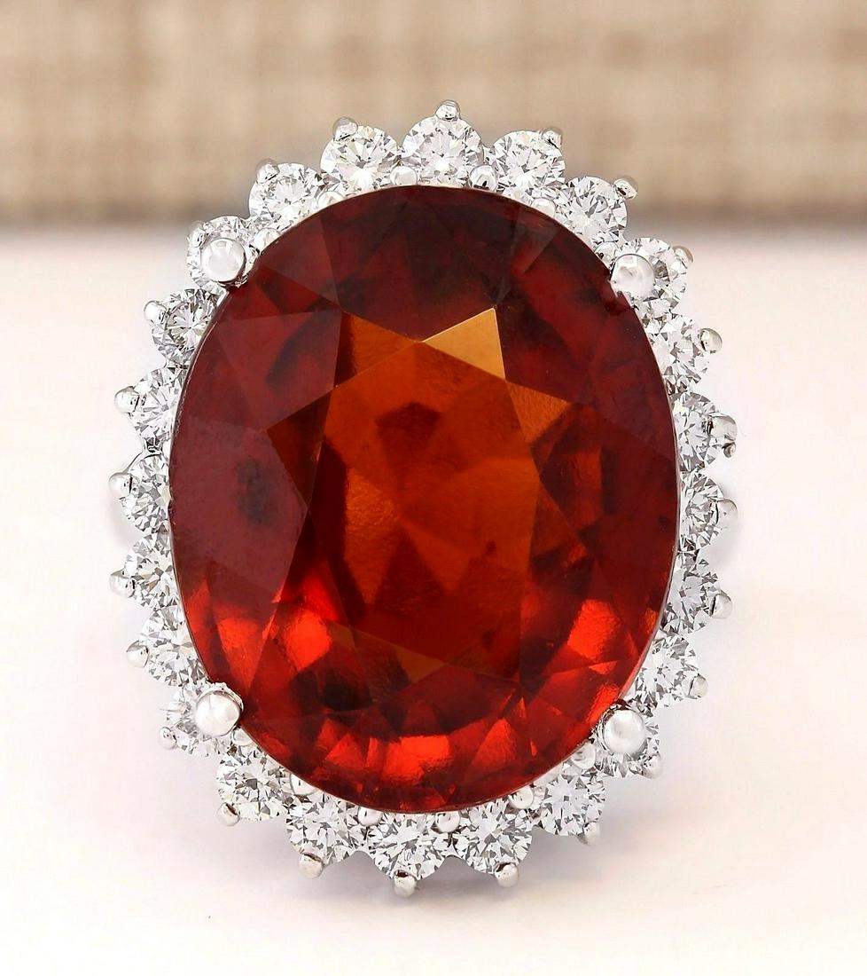 19.59 CTW Natural Hessonite Garnet And Diamond Ring In: 19.59 CTW Natural Hessonite Garnet And Diamond Ring In 18K White Gold Manufacturer's Suggested Retail Price: $ 7150.00 Stamped: 18K Ring Size: .5 Total Ring Weight: 9.1 Grams Diamond Weight: Total Nat