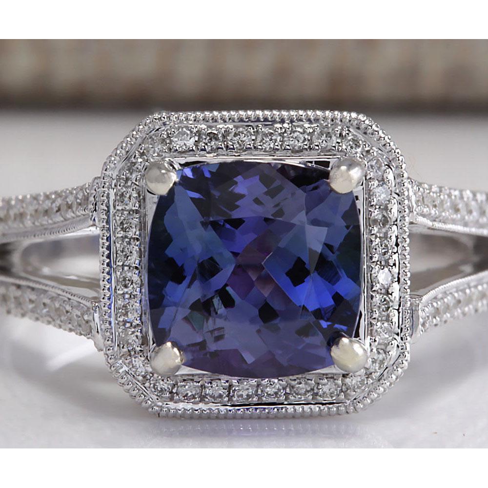 3.67 CTW Natural Blue Tanzanite And Diamond Ring In 14K: 3.67 CTW Natural Blue Tanzanite And Diamond Ring In 14K Solid White Gold Manufacturer's Suggested Retail Price: $ 7250.00 Stamped: 14K Ring Size: 7 Total Ring Weight: 8.3 Grams Diamond Weight: Total N