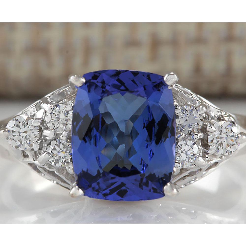 2.51 CTW Natural Blue Tanzanite And Diamond Ring In 18K: 2.51 CTW Natural Blue Tanzanite And Diamond Ring In 18K White Gold Manufacturer's Suggested Retail Price: $ 4800.00 Stamped: 18K Ring Size: 5.75 Total Ring Weight: 4.1 Grams Diamond Weight: Total Natu
