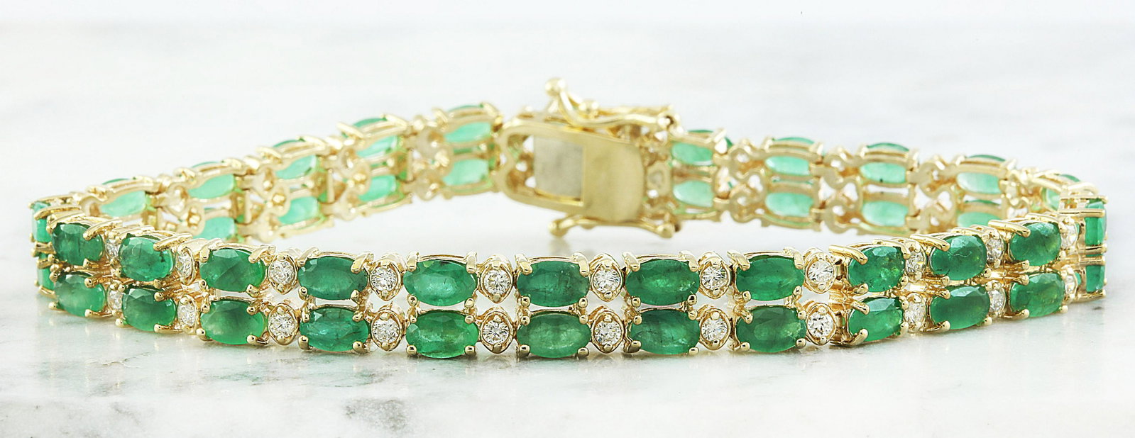 11.78 CTW Emerald 18K Yellow Gold Diamond Bracelet: 11.78 CTW Emerald 18K Yellow Gold Diamond Bracelet Manufacturer's Suggested Retail Price: $ 7950.00 Stamped: 18K Total Bracelet Weight: 14.5 Grams Bracelet Length: 7 Inches Emerald Weight: 10.58 Carat