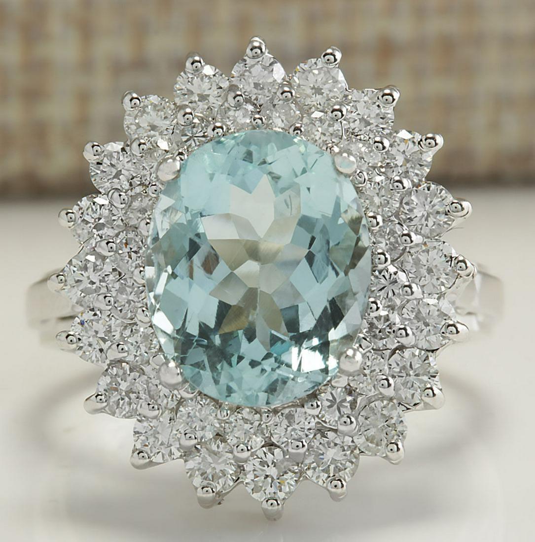 7.03 CTW Natural Aquamarine And Diamond Ring In 14K: 7.03 CTW Natural Aquamarine And Diamond Ring In 14K Solid White Gold Manufacturer's Suggested Retail Price: $ 7000.00 Stamped: 14K Ring Size: 6.5 Total Ring Weight: 6.8 Grams Diamond Weight: Total Nat