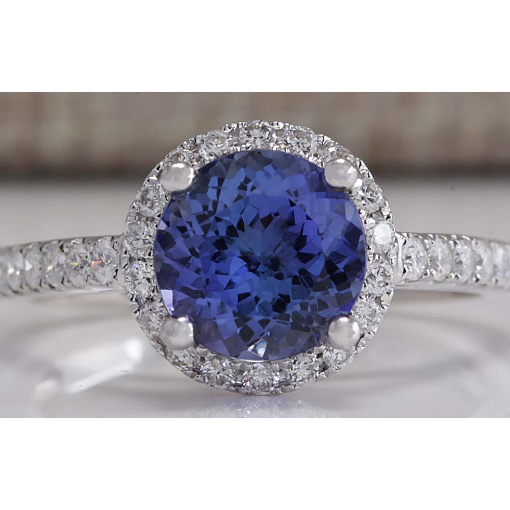 2.17 CTW Natural Blue Tanzanite And Diamond Ring In 18K: 2.17 CTW Natural Blue Tanzanite And Diamond Ring In 18K Solid White Gold Manufacturer's Suggested Retail Price: $ 4400.00 Stamped: 18K Ring Size: 6 Total Ring Weight: 3.4 Grams Diamond Weight: Total N