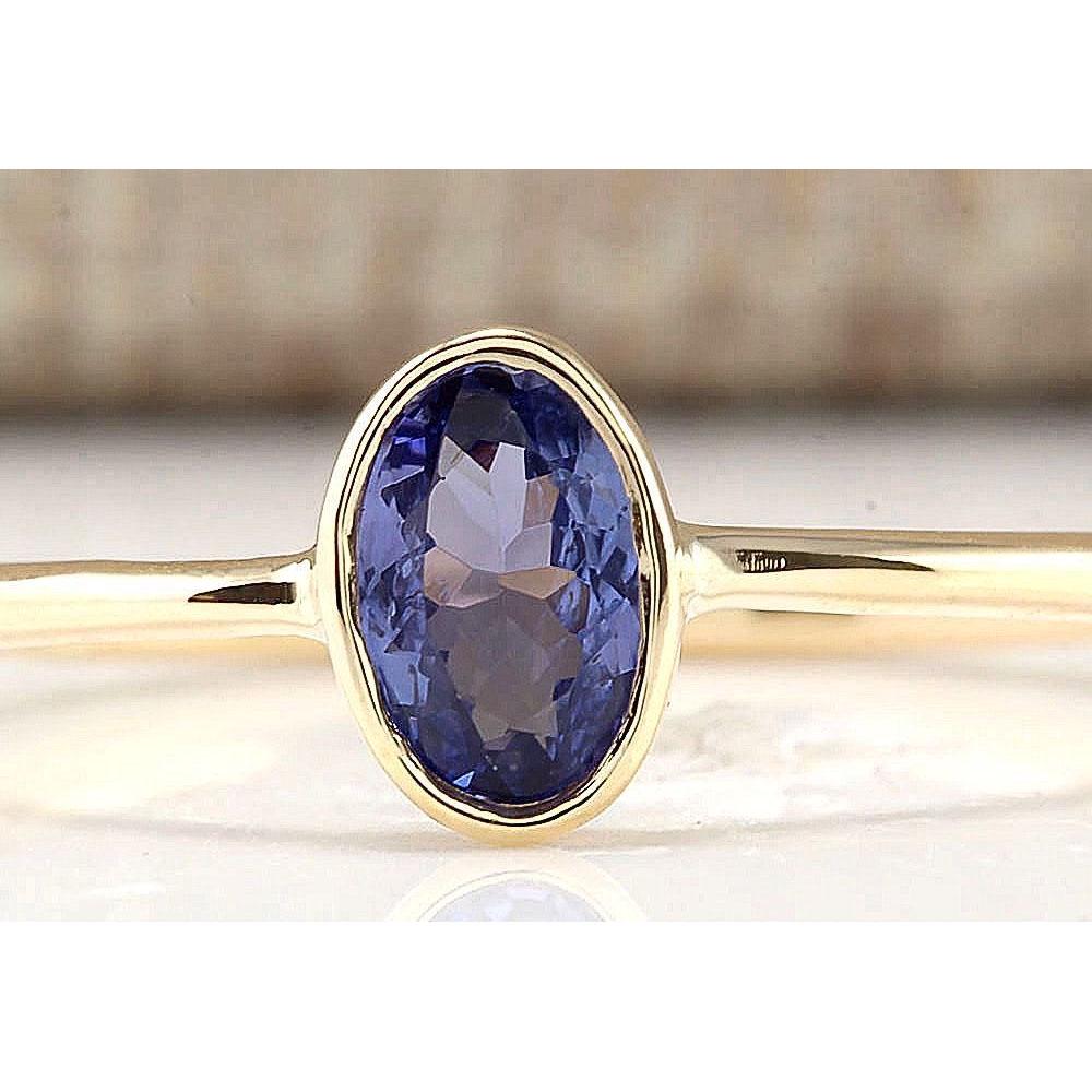 0.60 CTW Natural Tanzanite And Diamond Ring In 14k: .60 CTW Natural Tanzanite And Diamond Ring In 14k Yellow Gold Manufacturer's Suggested Retail Price: $ 900.00 Stamped: 14K Ring Size: 6.25 Total Ring Weight: 1.2 Grams Gemstone Weight: Total Natural T