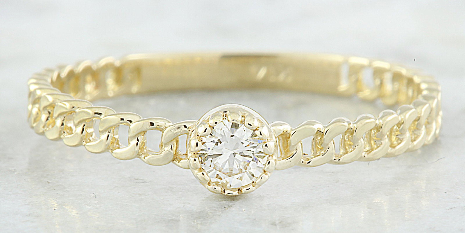 0.10 CTW Diamond 18K Yellow Gold Solitaire Ring: 0.10 CTW Diamond 18K Yellow Gold Solitaire Ring Manufacturer's Suggested Retail Price: $ 1450.00 Stamped: 18K Total Ring Weight: 1.2 Grams Diamond Weight: 0.10 carat (F-G Color, VS2-SI1 Clarity ) Face