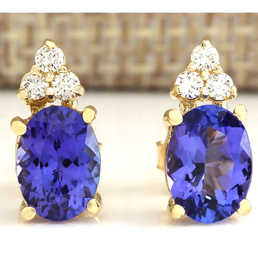 3.00 CTW Natural Blue Tanzanite And Diamond Earrings: 3.00 CTW Natural Blue Tanzanite And Diamond Earrings 18K Solid Yellow Gold Manufacturer's Suggested Retail Price: $ 3200.00 Stamped: 18K Total Earring Weight: 2.5Grams Diamond Weight: Total Natural di