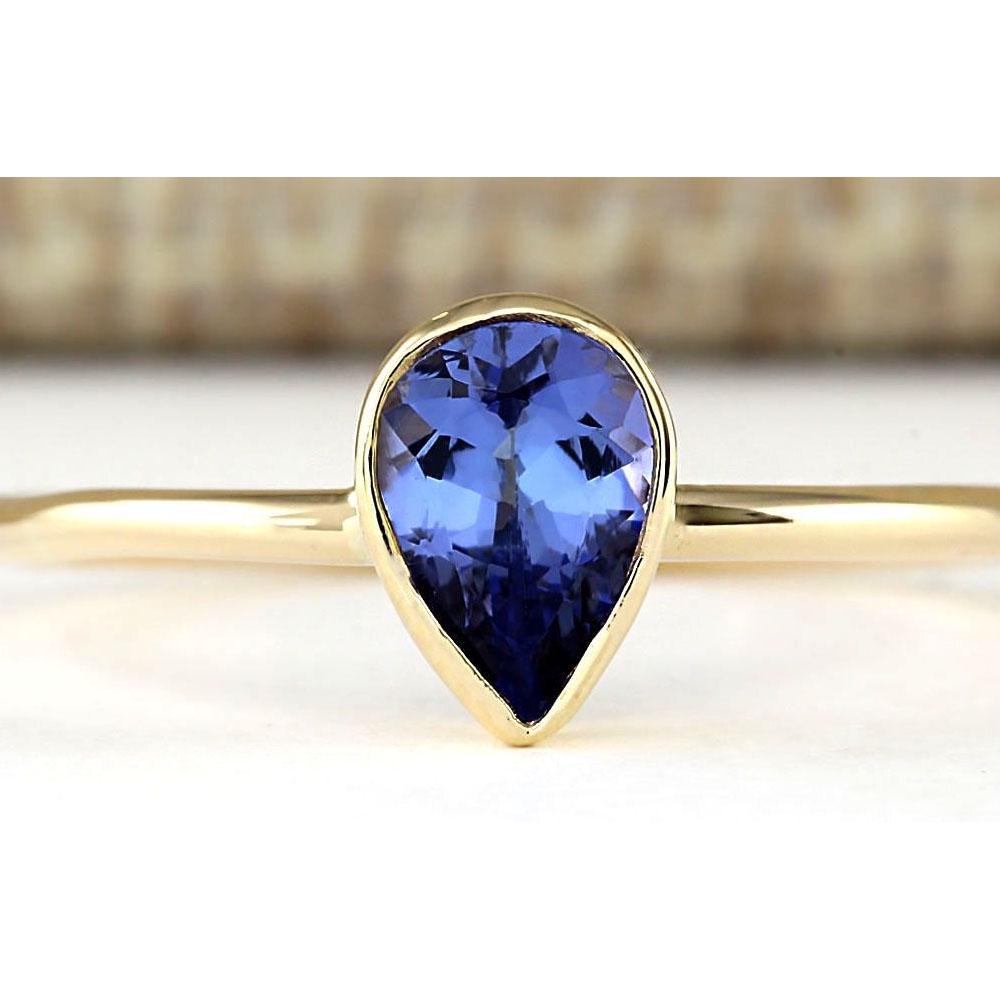 0.50 CTW Natural Tanzanite Ring In 18K Yellow Gold: .50 CTW Natural Tanzanite Ring In 18K Yellow Gold Manufacturer's Suggested Retail Price: $ 1000.00 Stamped: 18K Ring Size: 5.75 Total Ring Weight: 1.2 Grams Gemstone Weight: Total Natural Tanzanite We