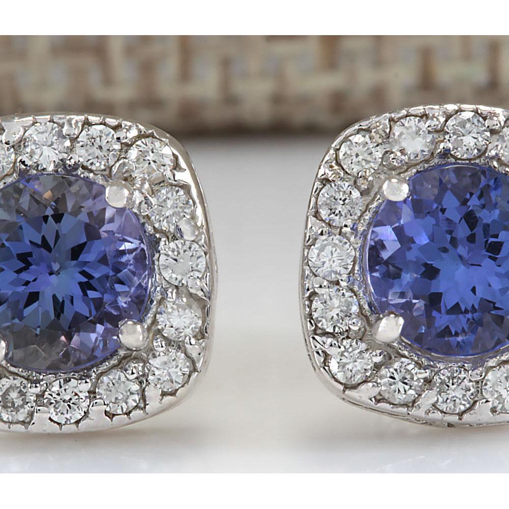 2.97 CTW Natural Tanzanite And Diamond Earrings 18K: 2.97 CTW Natural Tanzanite And Diamond Earrings 18K Solid White Gold Manufacturer's Suggested Retail Price: $ 4150.00 Stamped: 18K Total Earring Weight: 3 Grams Diamond Weight: Total Natural diamond w
