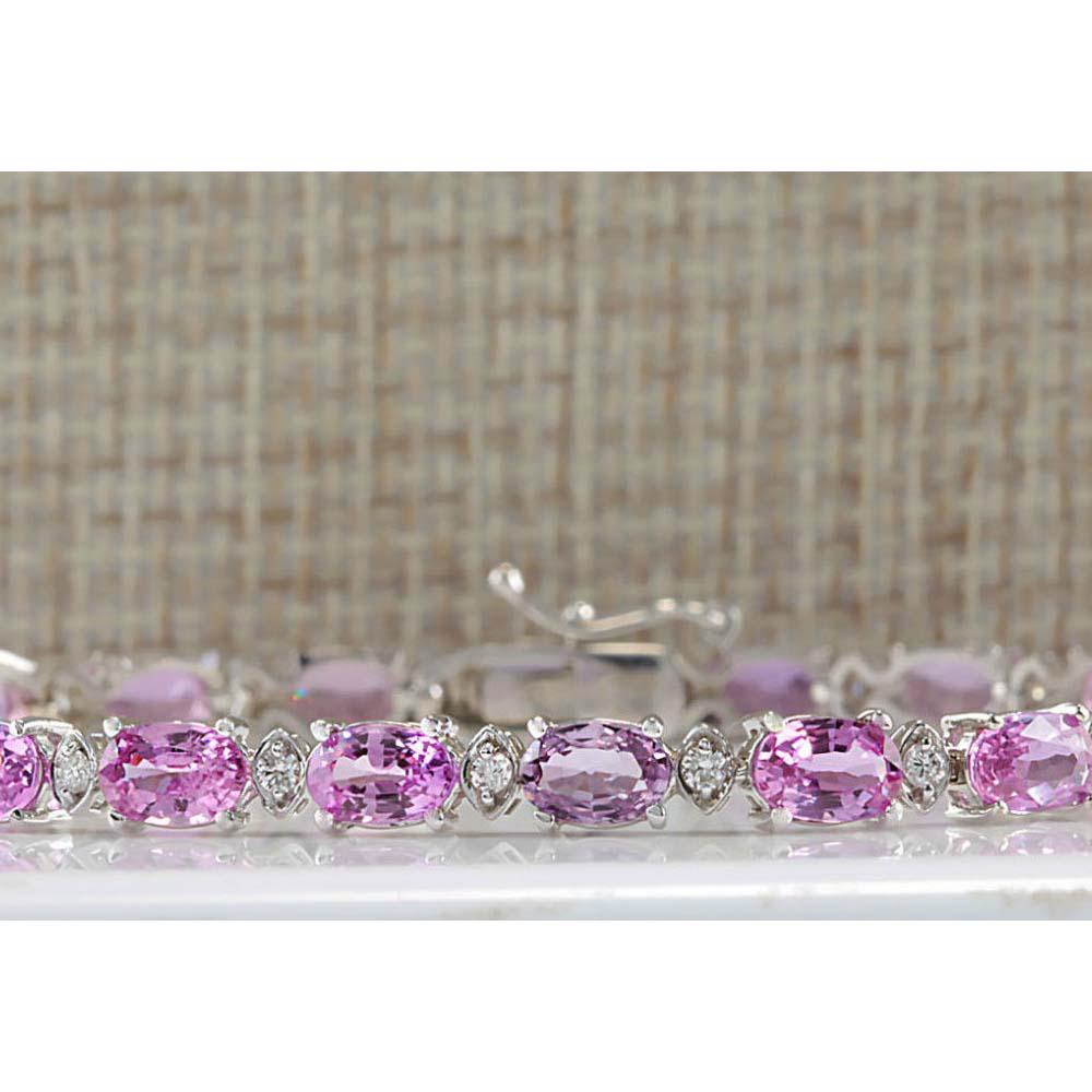 14.10CTW Natural Pink Sapphire And Diamond Bracelet In: 14.10CTW Natural Pink Sapphire And Diamond Bracelet In 18K Solid White Gold Manufacturer's Suggested Retail Price: $ 7900.00 Stamped: 18K Bracelet Width: 4.70mm Bracelet Length: 7.5 Inches Total Brace