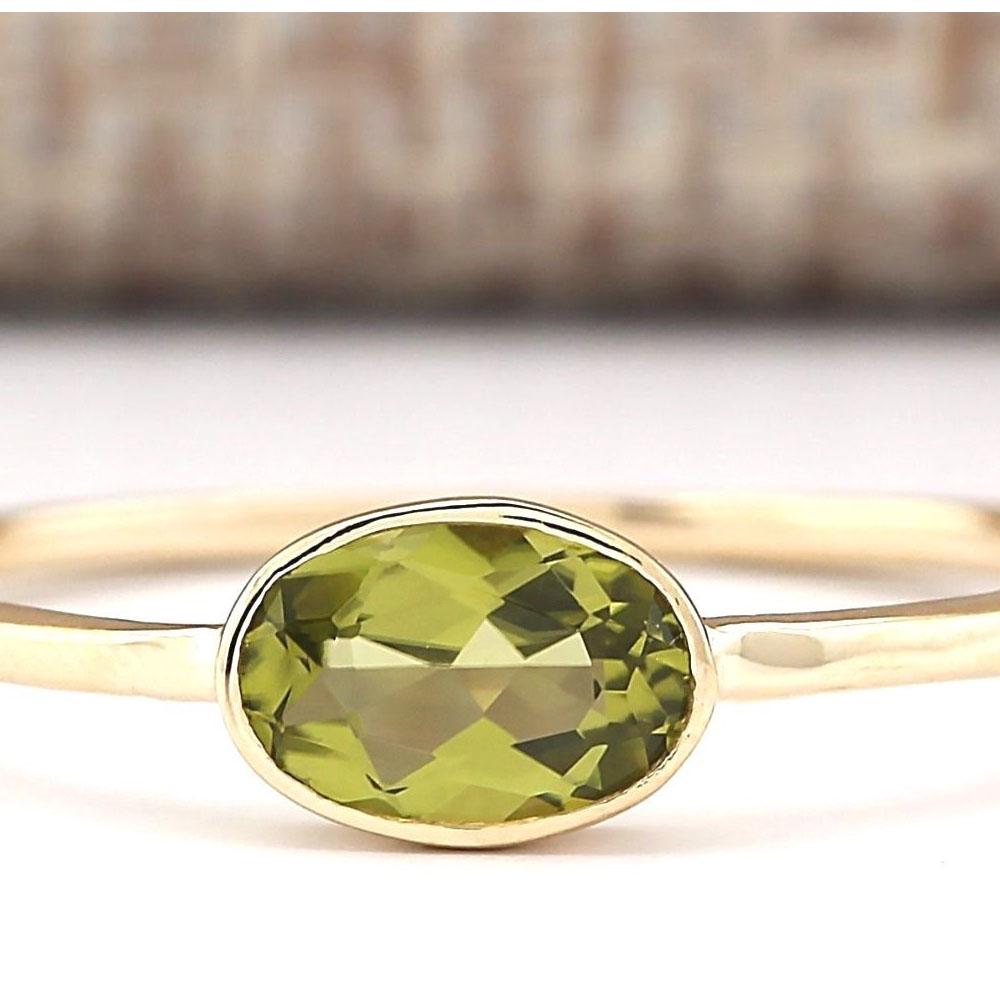 0.60 CTW Natural Peridot Ring In 14k Yellow Gold: 0.60 CTW Natural Peridot Ring In 14k Yellow Gold Manufacturer's Suggested Retail Price: $ 750.00 Stamped: 14K Ring Size: 6.5 Total Ring Weight: 1 Grams Gemstone Weight: Total Natural Peridot Weight is
