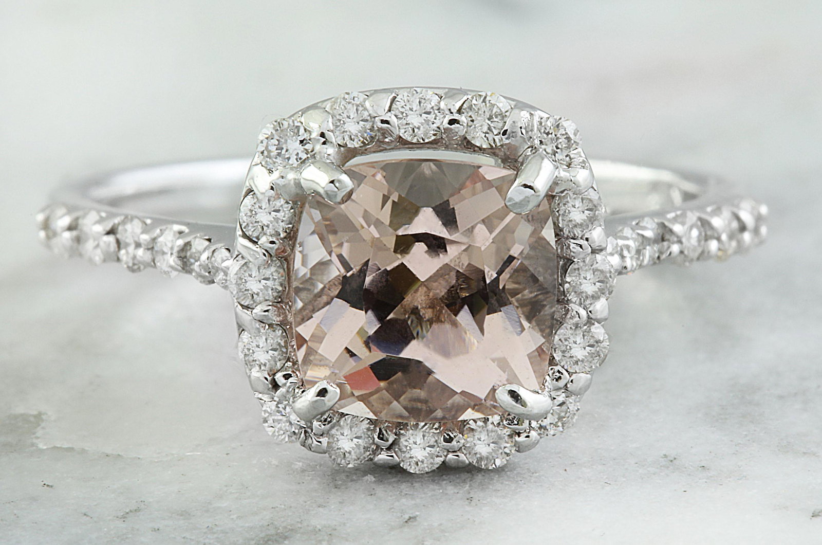 2.00 CTW Morganite 14K White Gold Diamond Ring: 2.00 CTW Morganite 14K White Gold Diamond Ring Manufacturer's Suggested Retail Price: $ 2550.00 Stamped: 14K Total Ring Weight: 3 Grams Morganite Weight 1.50 Carat (7.00x7.00 Millimeters) Diamond Weig
