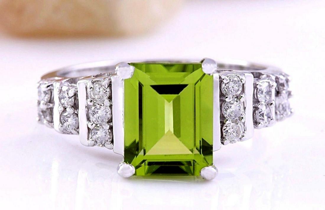 3.05 CTW Natural Peridot 14K Solid White Gold Diamond: 3.05 CTW Natural Peridot 14K Solid White Gold Diamond Ring Manufacturer's Suggested Retail Price: $ 2650.00 3.05 Carat Natural Peridot 14K Solid White Gold Diamond Ring Item Type: Ring Item Style: Eng