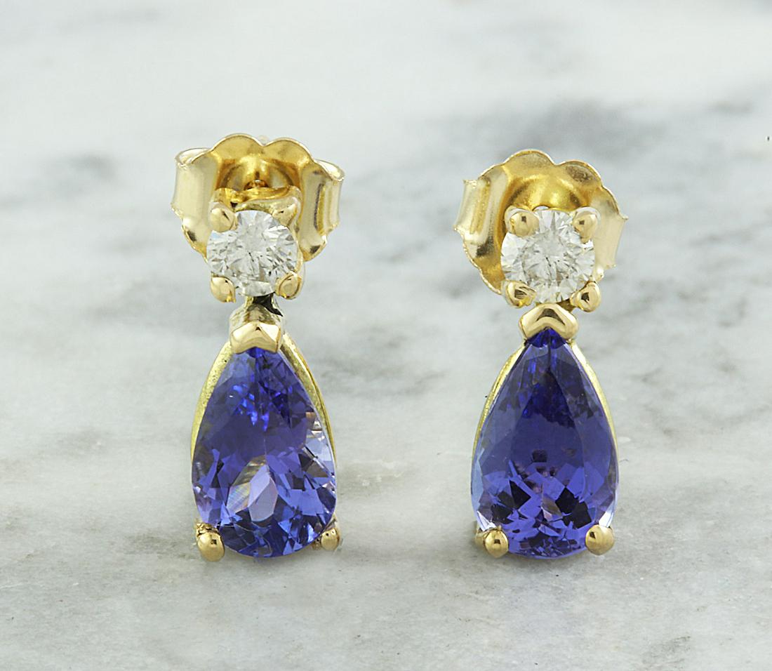 2.25 CTW Tanzanite 14K Yellow Gold Diamond Earrings: 2.25 CTW Tanzanite 14K Yellow Gold Diamond Earrings Manufacturer's Suggested Retail Price: $ 2450.00 Stamped: 14K Total Earrings Weight: 2.5 Grams Tanzanite Weight: 2.00 Carat (7.50x4.90 Millimeters) 
