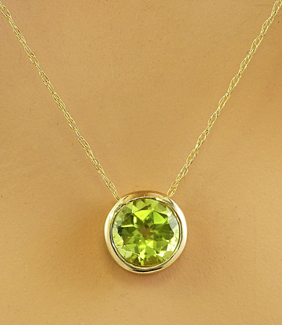 1.50 CTW Peridot 18K Yellow Gold Necklace: 1.50 CTW Peridot 18K Yellow Gold Necklace Manufacturer's Suggested Retail Price: $ 1450.00 Stamped: 18K Total Necklace Weight: 1.4 Grams Length: 18 Inches Peridot Weight: 1.50 Carat (6.50x6.50 Millime