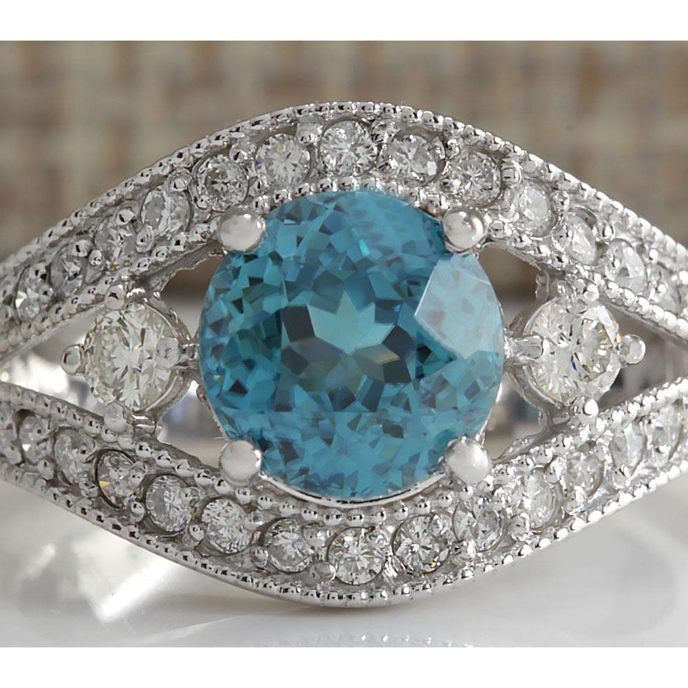 4.16 CTW Natural Blue Zircon And Diamond Ring 18K Solid: 4.16 CTW Natural Blue Zircon And Diamond Ring 18K Solid White Gold Manufacturer's Suggested Retail Price: $ 5150.00 Stamped: 18K Ring Size: 7.25 Total Ring Weight: 5.5 Grams Diamond Weight: Total Natu