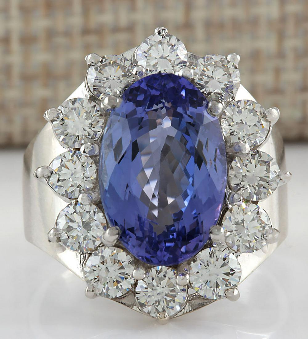 9.35 CTW Natural Blue Tanzanite And Diamond Ring 14K: 9.35 CTW Natural Blue Tanzanite And Diamond Ring 14K Solid White Gold Manufacturer's Suggested Retail Price: $ 18350.00 Stamped: 14K Ring Size: 7.5 Total Ring Weight: 11 Grams Diamond Weight: Total Na