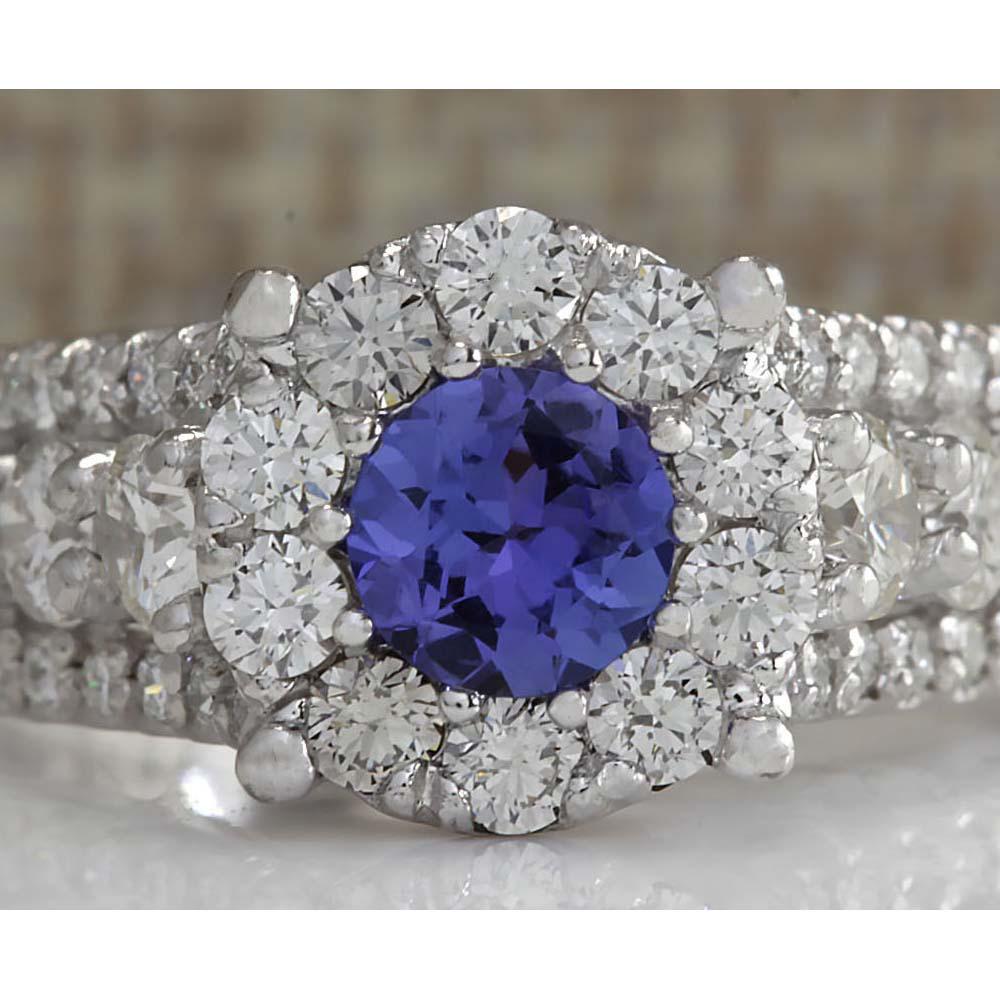 2.36 CTW Natural Blue Tanzanite And Diamond Ring In 18K: 2.36 CTW Natural Blue Tanzanite And Diamond Ring In 18K Solid White Gold Manufacturer's Suggested Retail Price: $ 7950.00 Stamped: 18K Ring Size: 6.25 Total Ring Weight: 5.9 Grams Diamond Weight: Tota