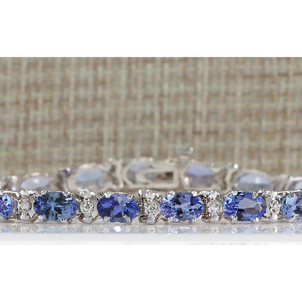 8.74 CTW Natural Blue Tanzanite Bracelet In 14K White: 8.74 CTW Natural Blue Tanzanite Bracelet In 14K White Gold Manufacturer's Suggested Retail Price: $ 2950.00 Stamped: 14K Length: 7 inch Total Bracelet Weight: 8.1 Grams Gemstone Weight: Total Natural 