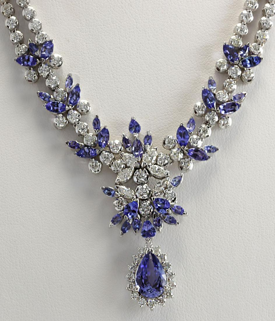 19.42 CTW Natural Tanzanite And Diamond Necklace In 18K: 19.42 CTW Natural Tanzanite And Diamond Necklace In 18K White Gold Manufacturer's Suggested Retail Price: $ 24400.00 Stamped: 18K Total Necklace Weight: 38Grams Diamond Weight: Total Natural diamond w