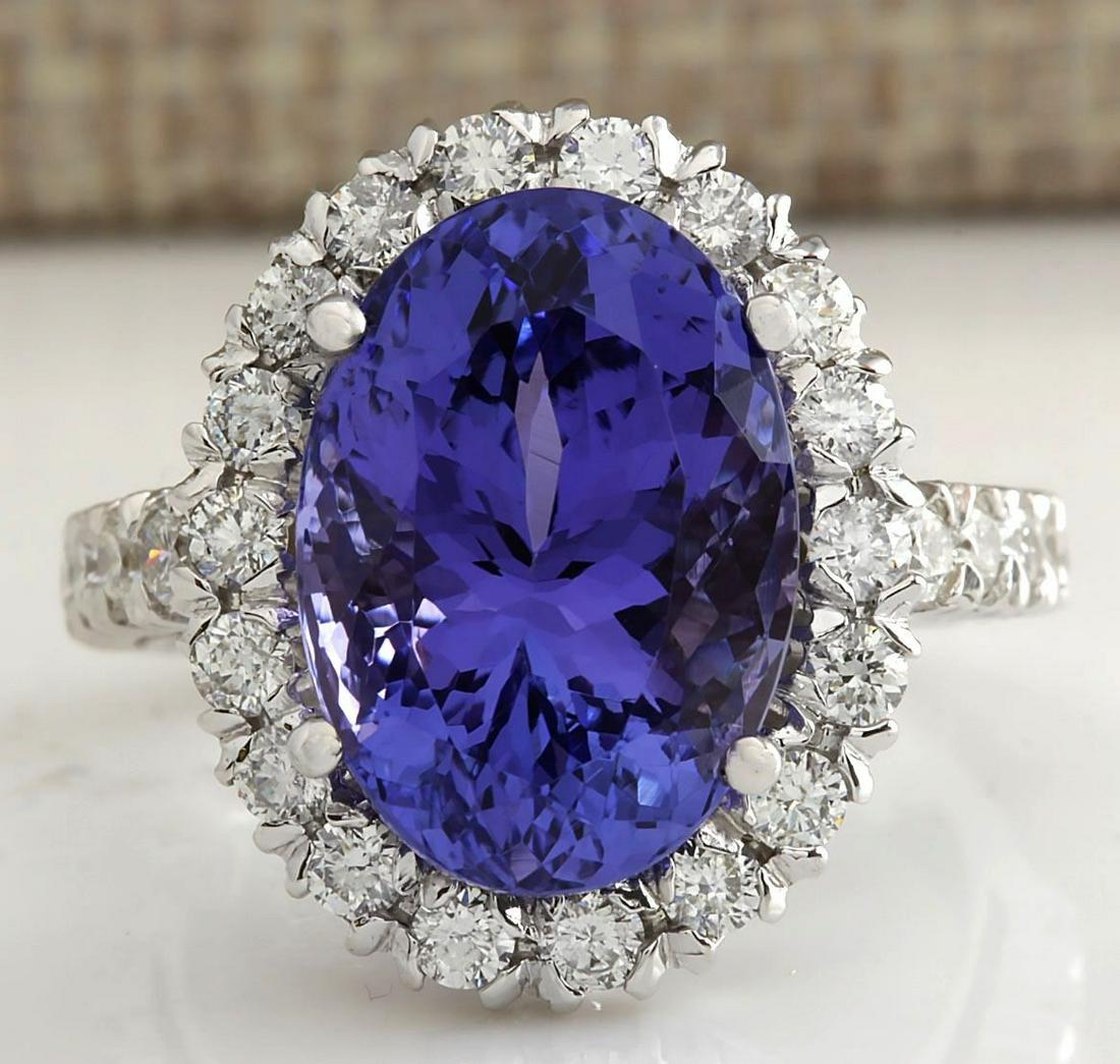 10.66 CTW Natural Blue Tanzanite And Diamond Ring In: 10.66 CTW Natural Blue Tanzanite And Diamond Ring In 18K White Gold Manufacturer's Suggested Retail Price: $ 9600.00 Stamped: 18K Ring Size: 6.75 Total Ring Weight: 7.7 Grams Diamond Weight: Total Nat