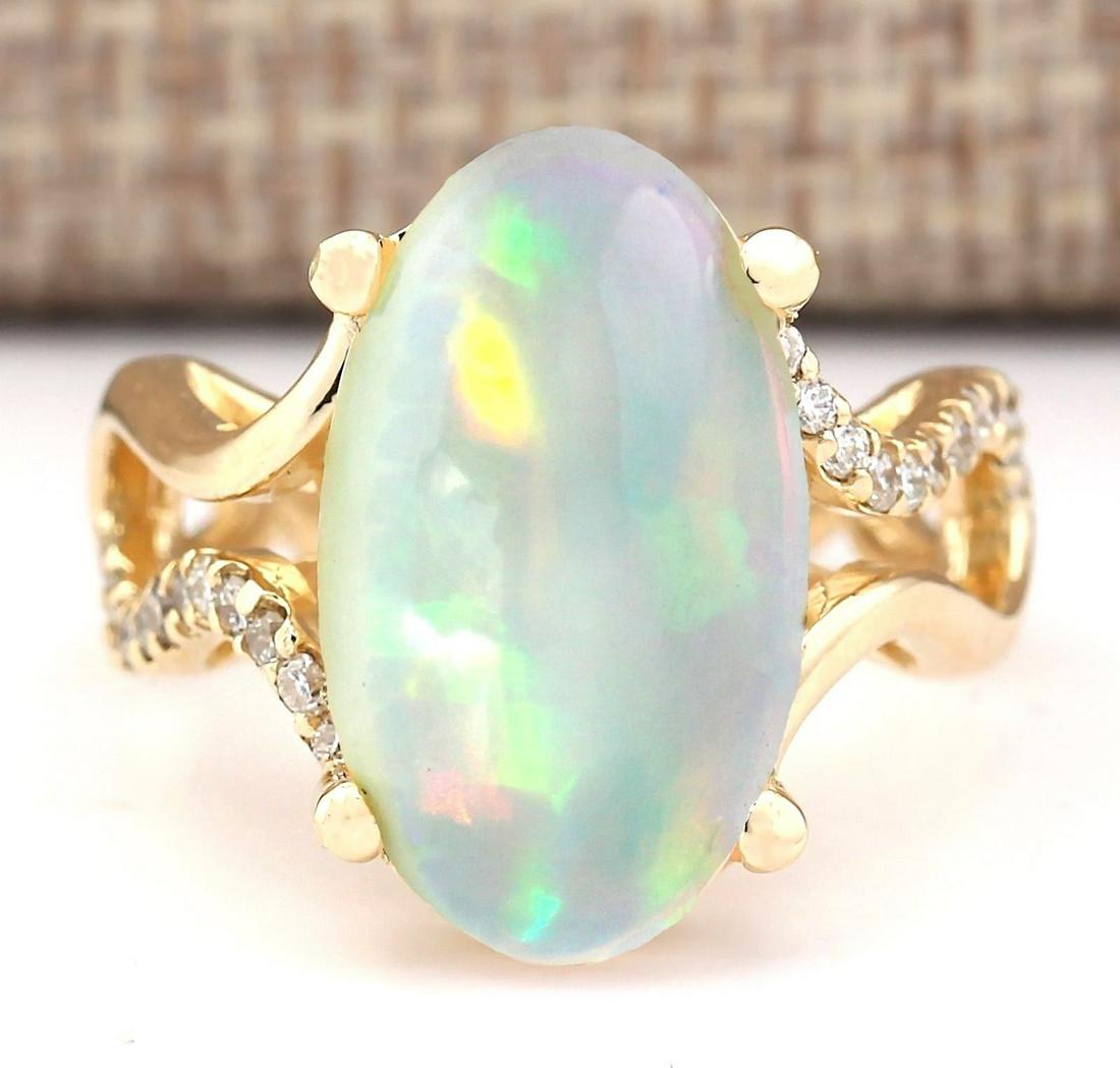 6.50 CTW Natural Opal And Diamond Ring In 18K Yellow: 6.50 CTW Natural Opal And Diamond Ring In 18K Yellow Gold Manufacturer's Suggested Retail Price: $ 4400.00 Stamped: 18K Ring Size: 7 Total Ring Weight: 8.1 Grams Diamond Weight: Total Natural diamond 