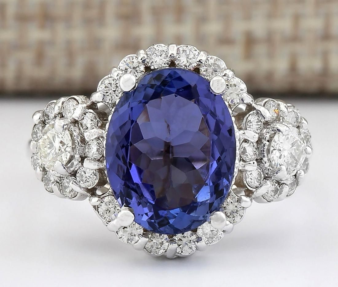 4.80 CTW Natural Blue Tanzanite And Diamond Ring 14k: 4.80 CTW Natural Blue Tanzanite And Diamond Ring 14k Solid White Gold Manufacturer's Suggested Retail Price: $ 4800.00 Stamped: 14K Ring Size: 6.5 Total Ring Weight: 5.5 Grams Diamond Weight: Total Na